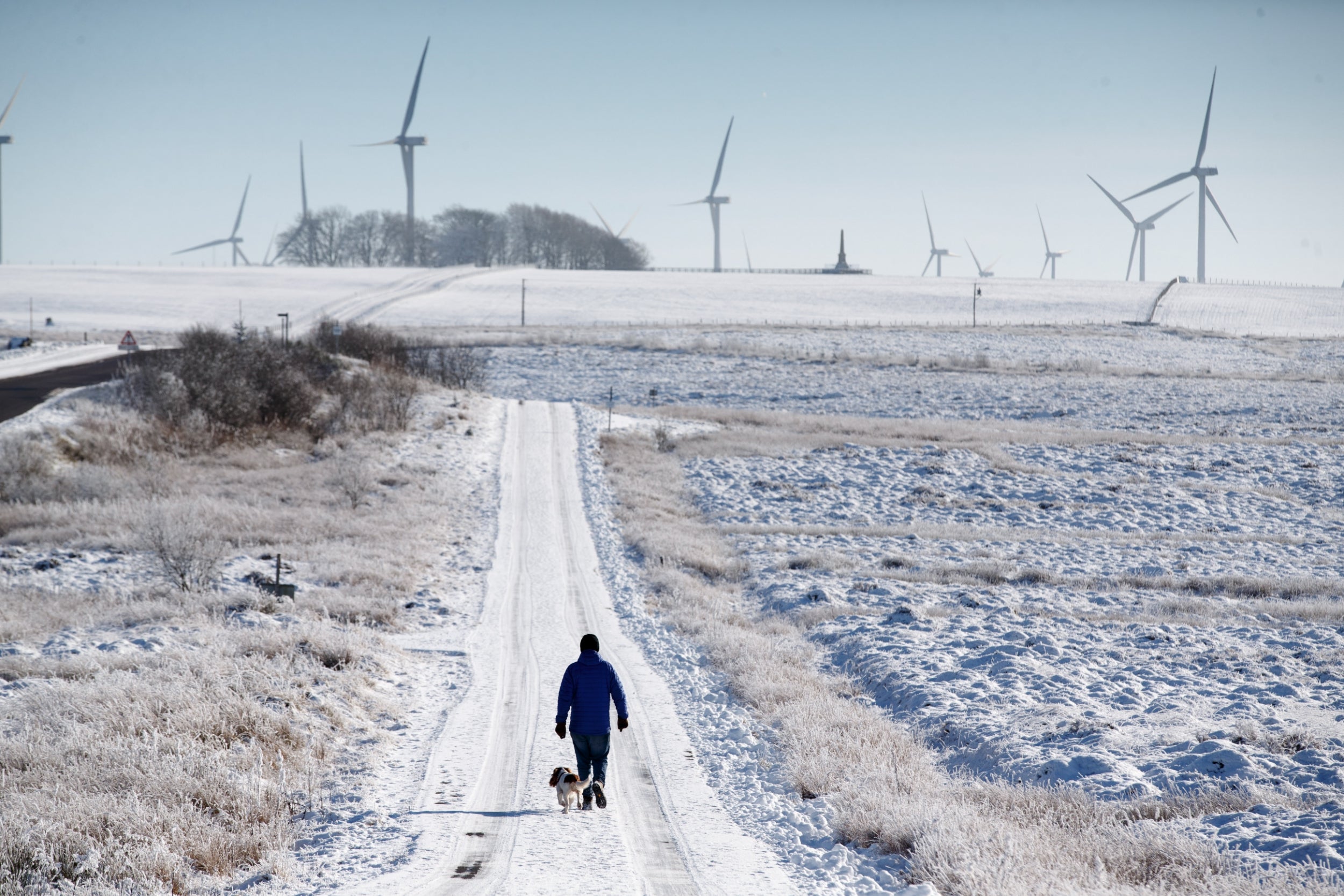 People enjoying a walk through Whitelee Windfarm in North Ayrshire, Scotland