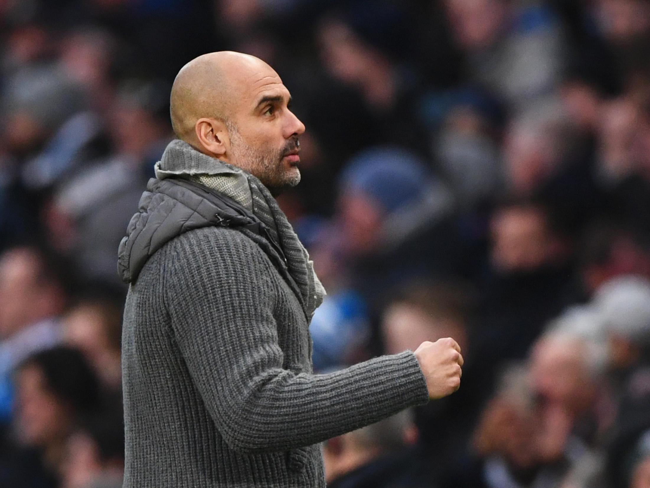 Pep Guardiola celebrates after the final whistle at the Etihad Stadium