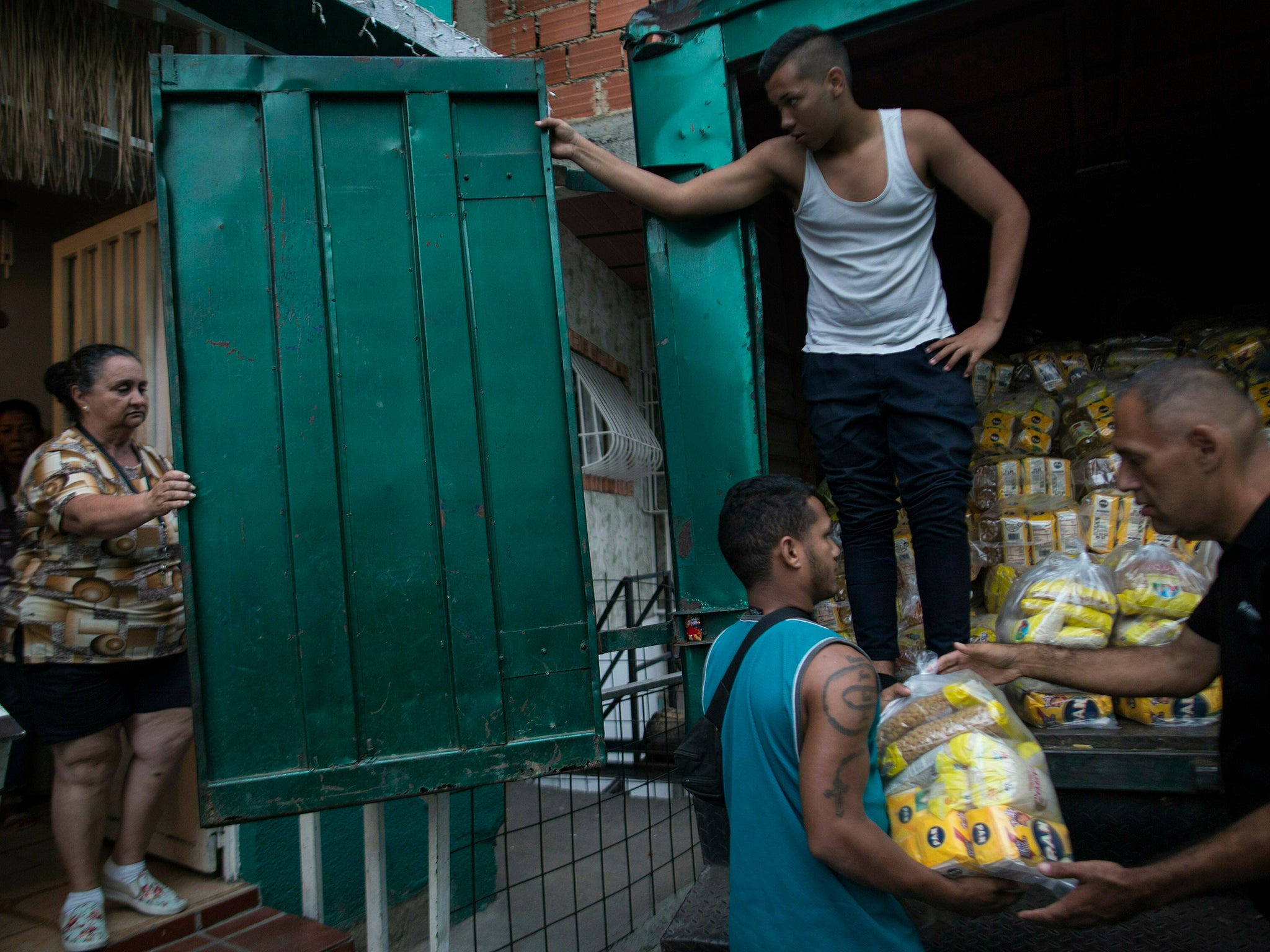 Neighbours receive subsidised food from the government food distribution programme Clap