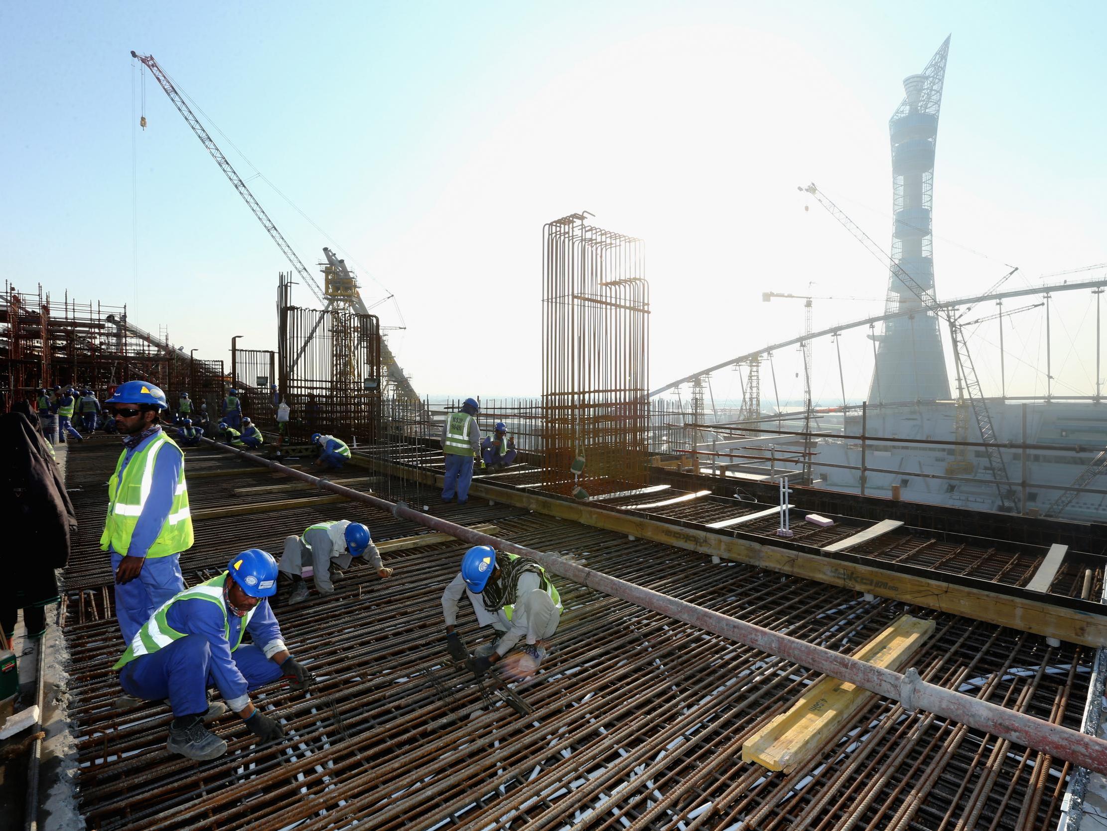 Construction workers on the Khalifa International Stadium ahead of the 2022 World Cup