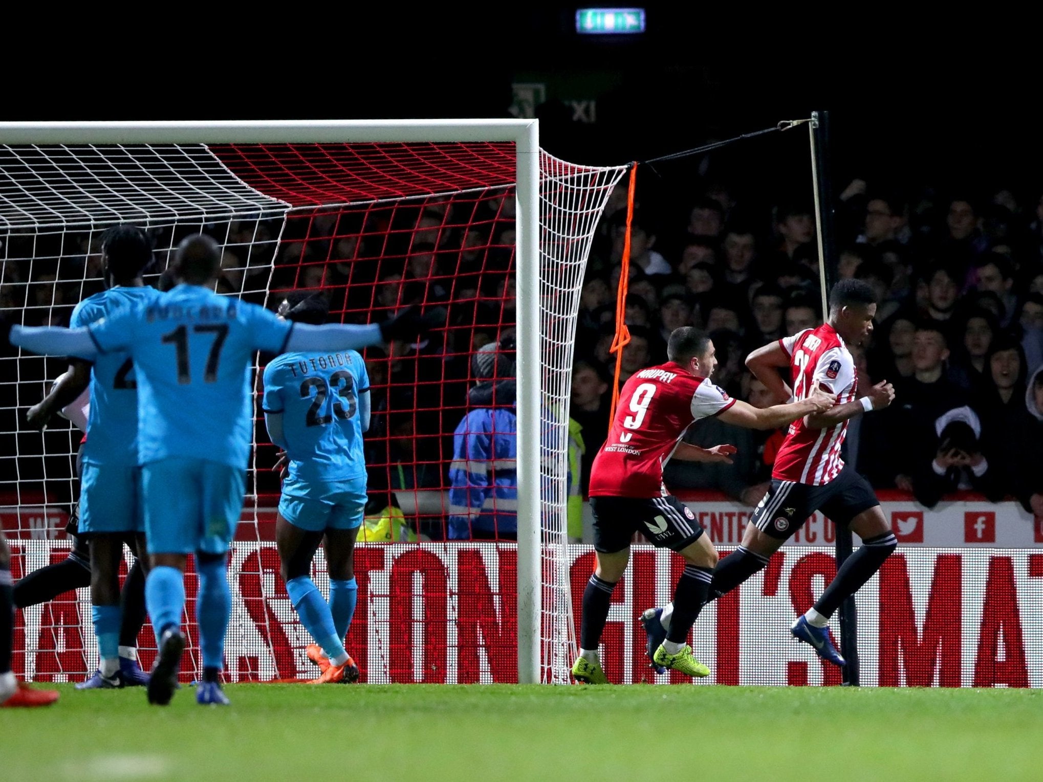 Brentford's Julian Jeanvier (right) celebrates scoring his side's second goal