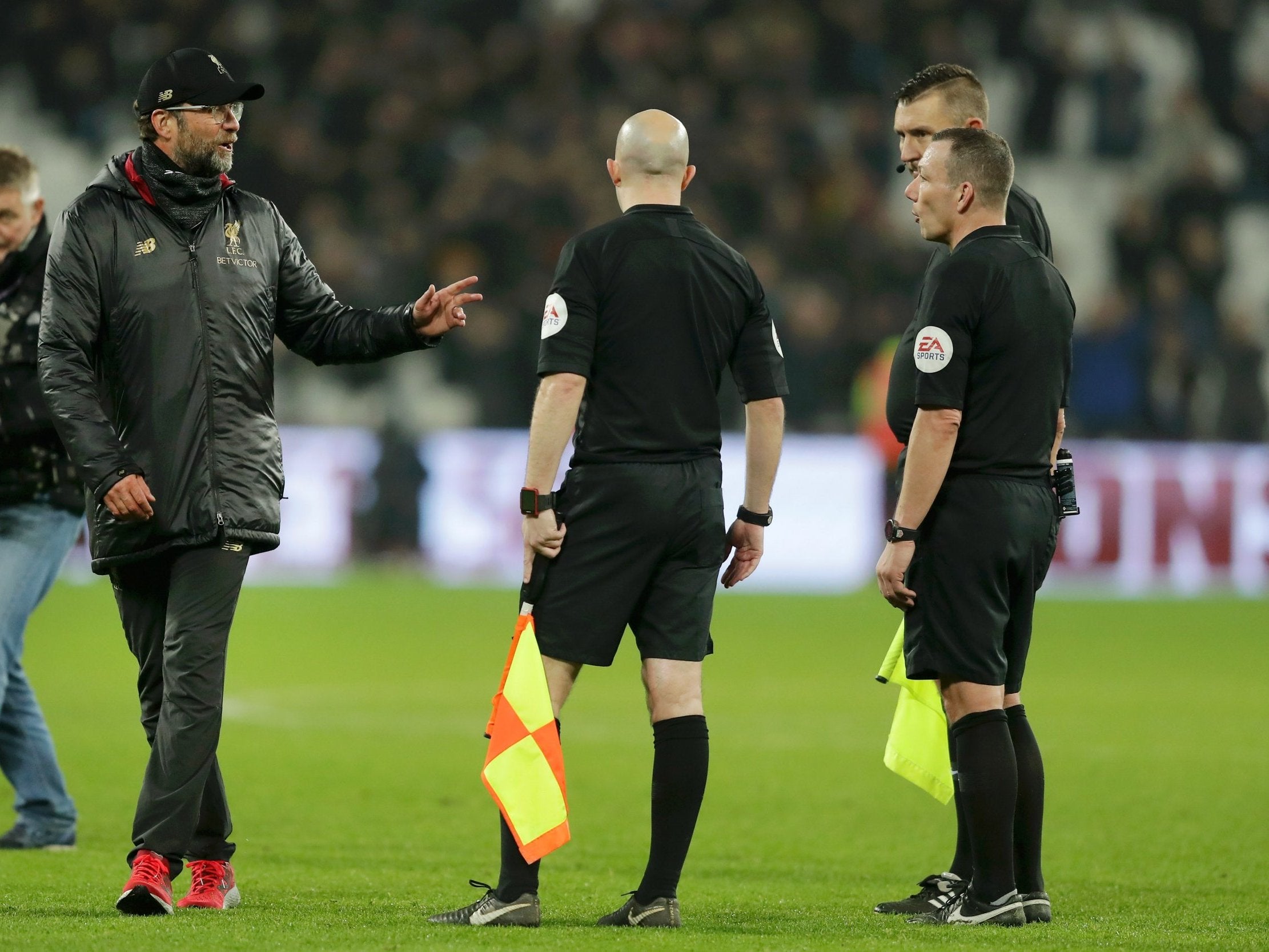 Jurgen Klopp speaks to Kevin Friend at full-time