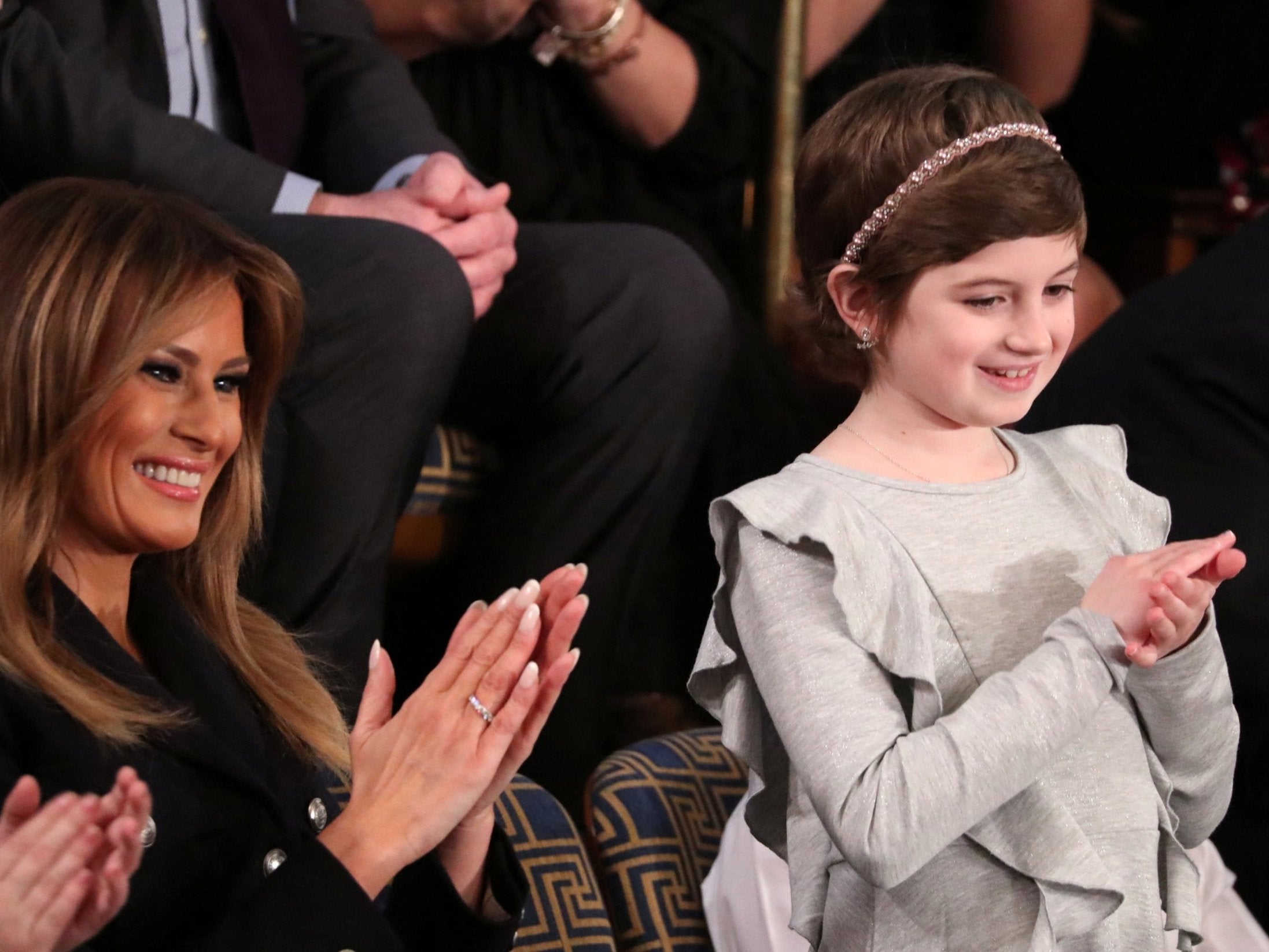 First lady Melania Trump applauds with cancer survivor Grace Eline as she is mentioned by US president Donald Trump in his second State of the Union address