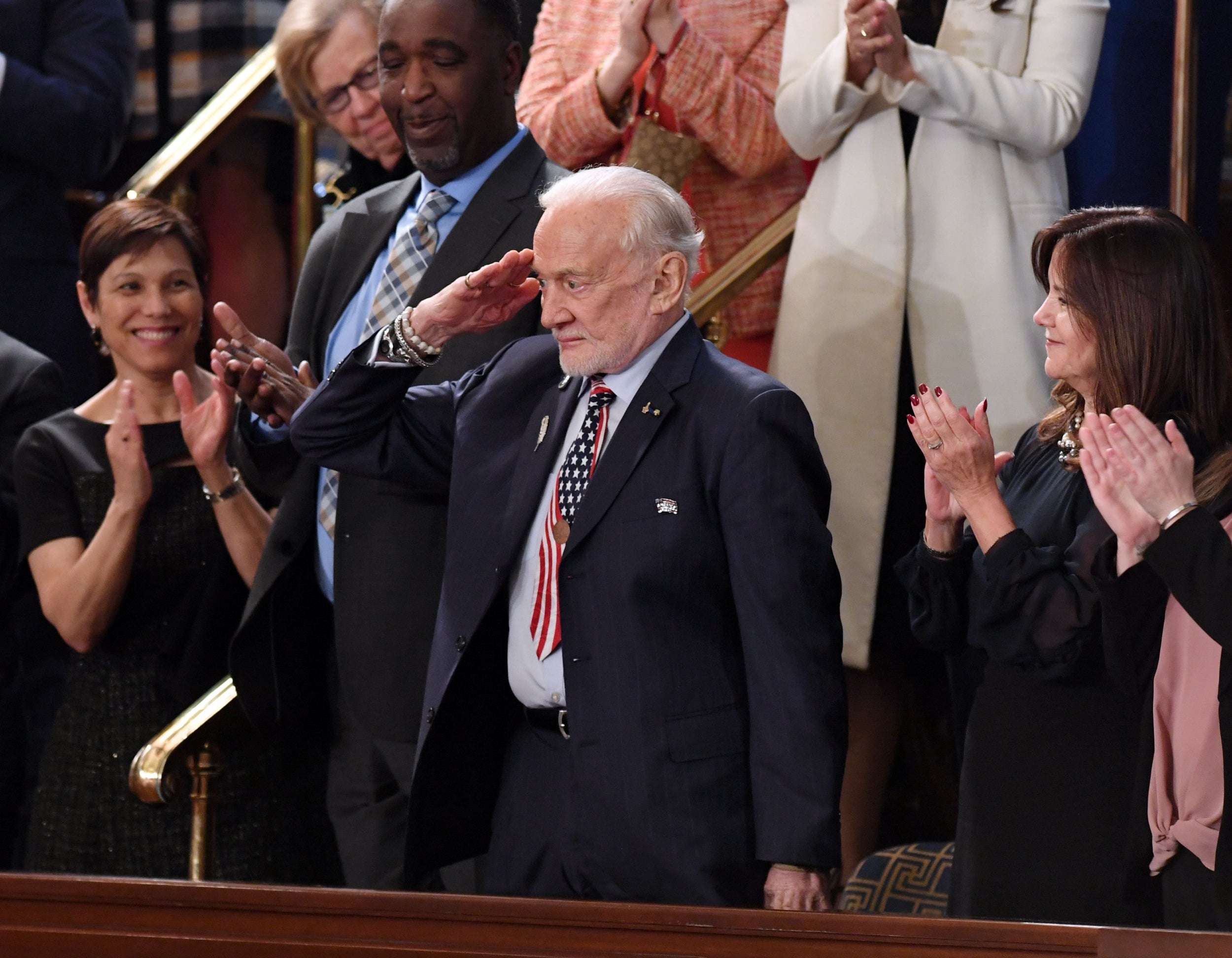 Aldrin salutes as he is honored by U.S. President Donald Trump during the State of the Union address at the U.S. Capitol in Washington, DC on February 5, 2019