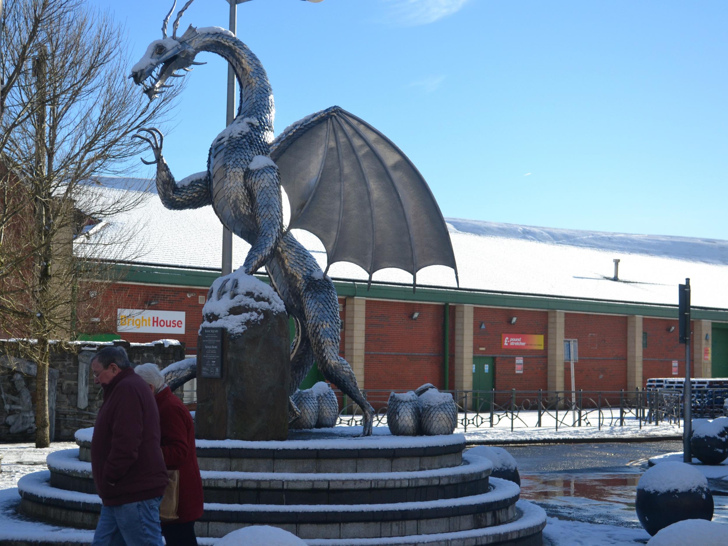 ‘Shiny ornaments in the town centre’: The EU-funded ‘Heart of the Furnace’ sculpture, with the signs for BrightHouse and Poundstretcher behind