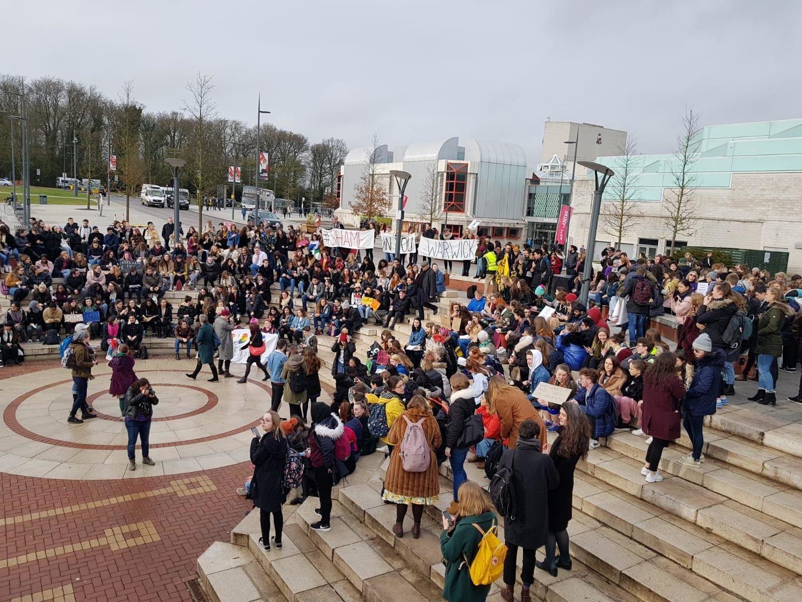 Hundreds of students marched on the campus in a protest against the university's handling of the rape threats.