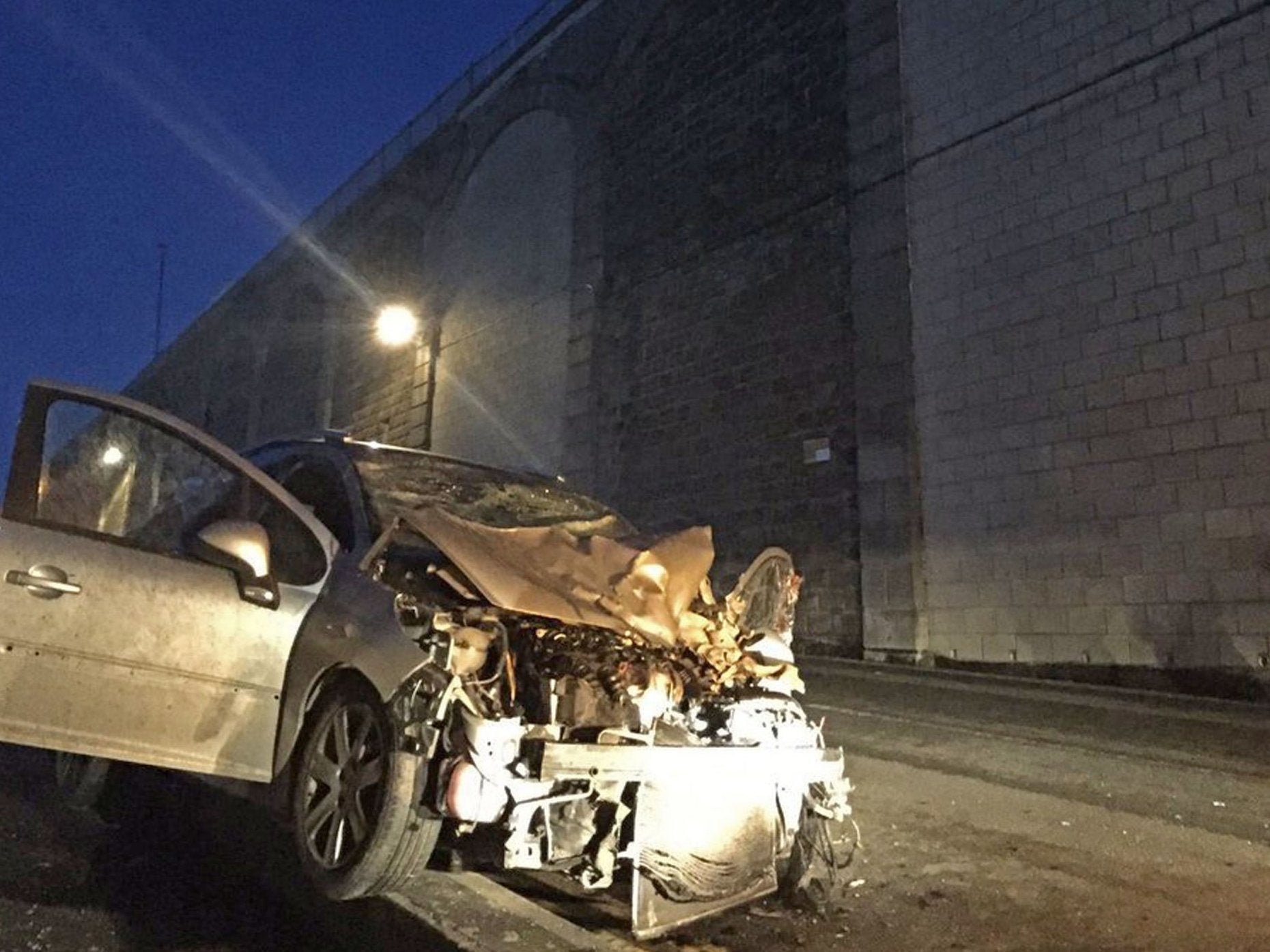 Handout photo issued by Kent Police of a car which plunged off a cliff in Ramsgate during a police chase