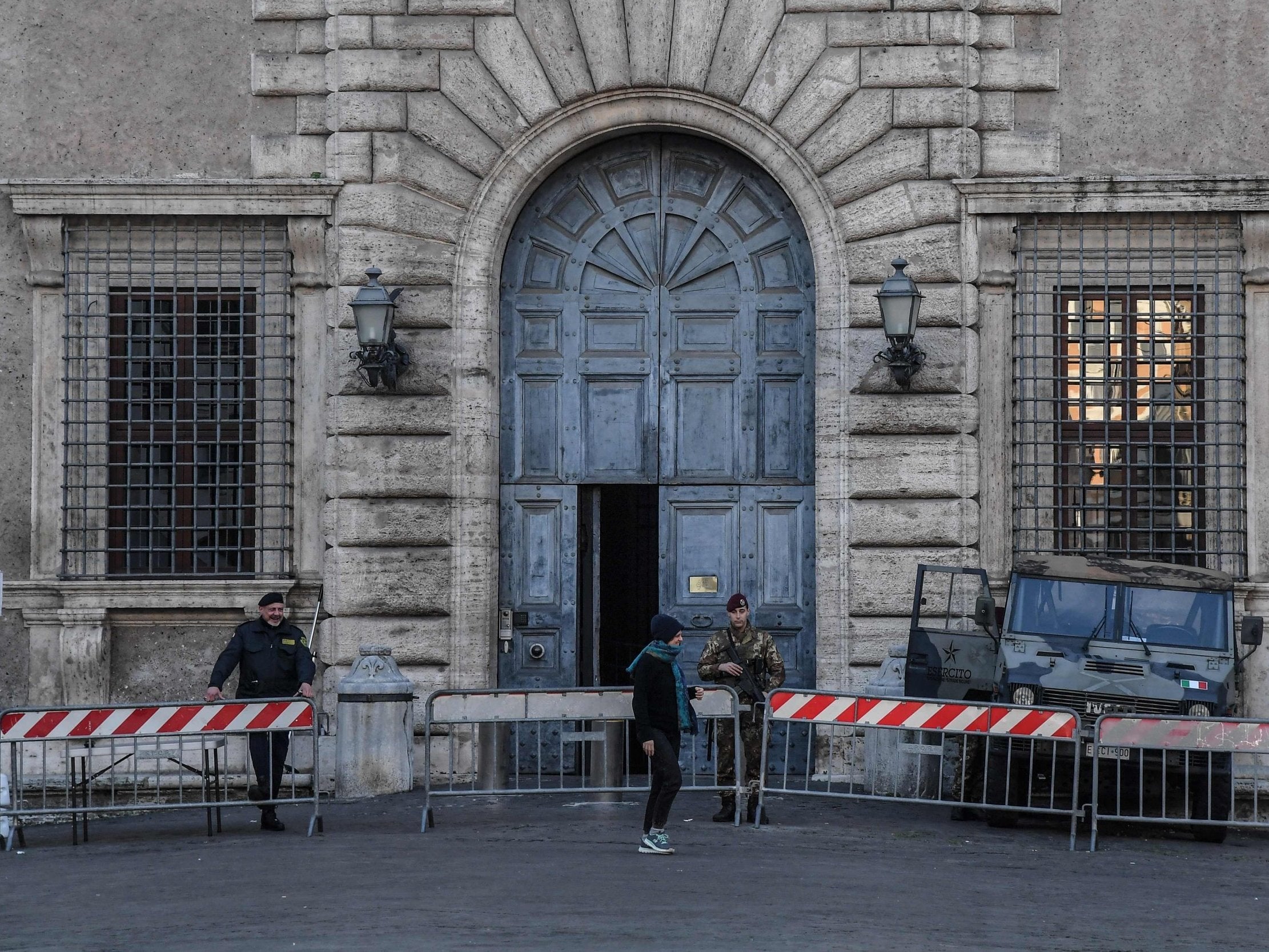 A soldier guards the main entrance of the Palazzo Farnese, site of the French embassy in Rome