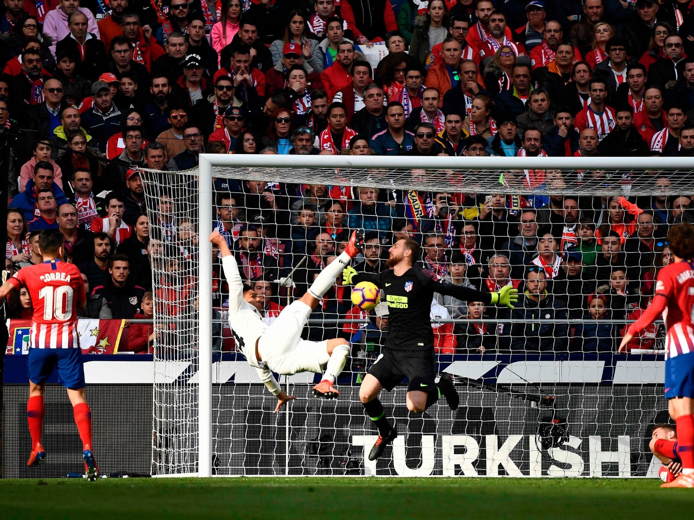 Real Madrid's Casemiro scores against Atletico Madrid