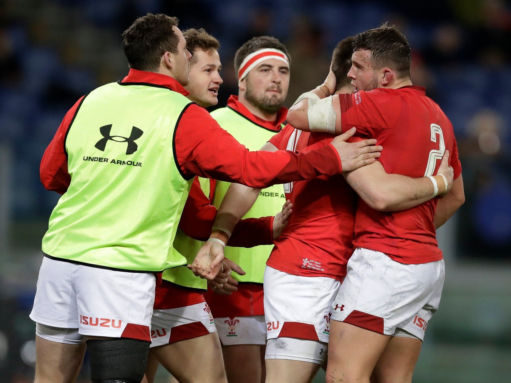 Josh Adams celebrates scoring Wales' first try in the 26-15 victory over Italy