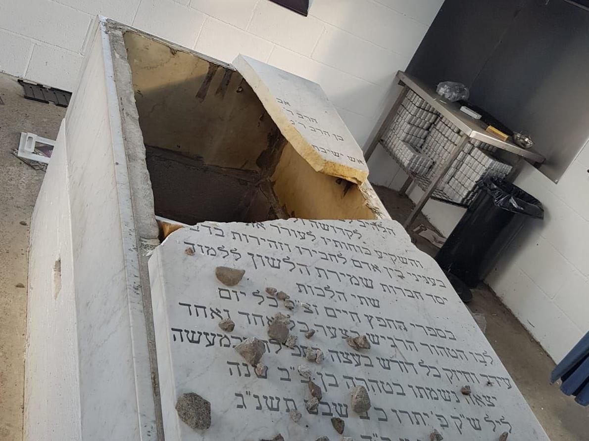 The headstone of a prominent member of Greater Manchester's Jewish community was smashed during the attack