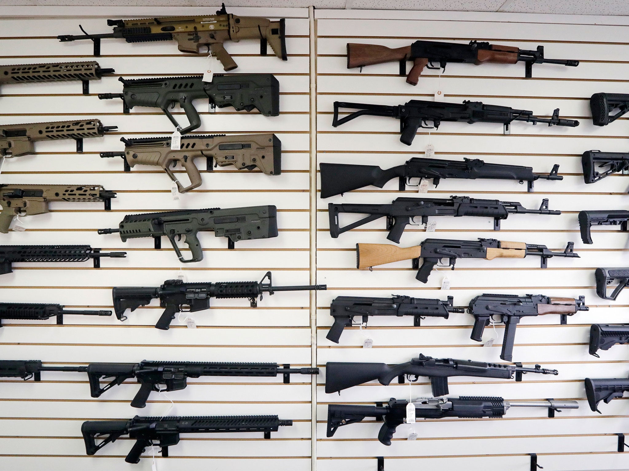 Semi-automatic rifles on the wall of a gun shop in Lynnwood, Washington