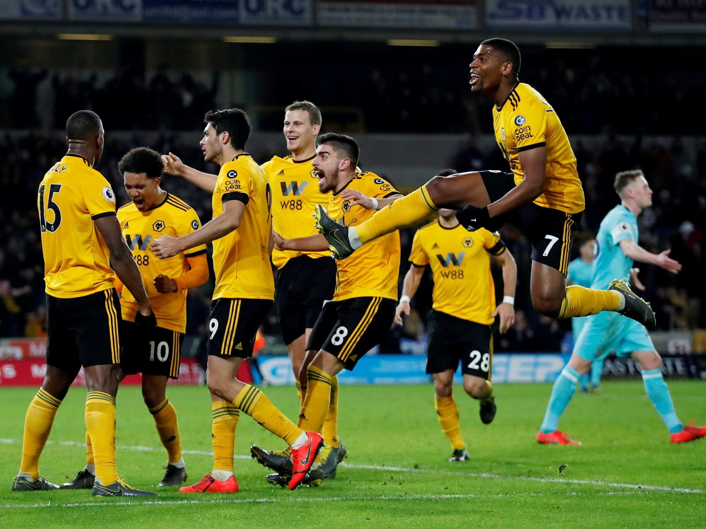 Willy Boly, left, celebrates his late winner