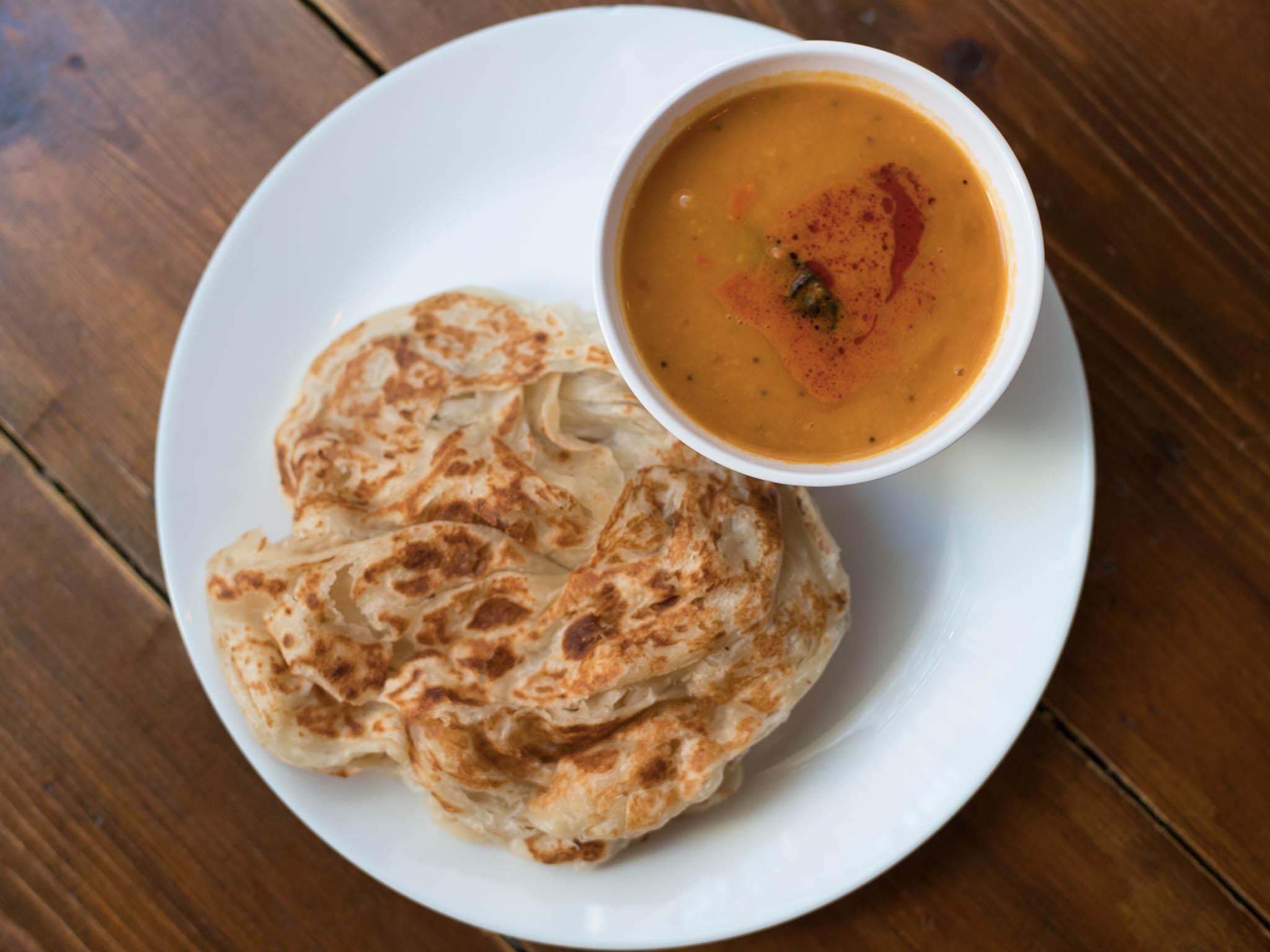 Roti King’s outpost at the food court is Gopal’s Corner, serving little bowls of dal and roti bread like this