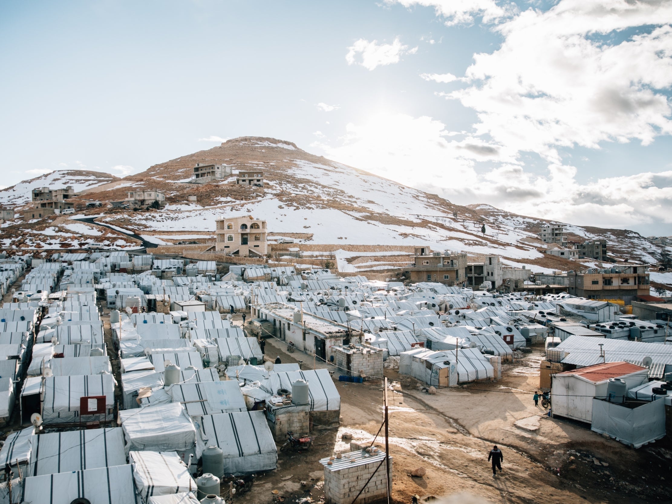 The snow-capped mountains overlooking Al Wafa camp