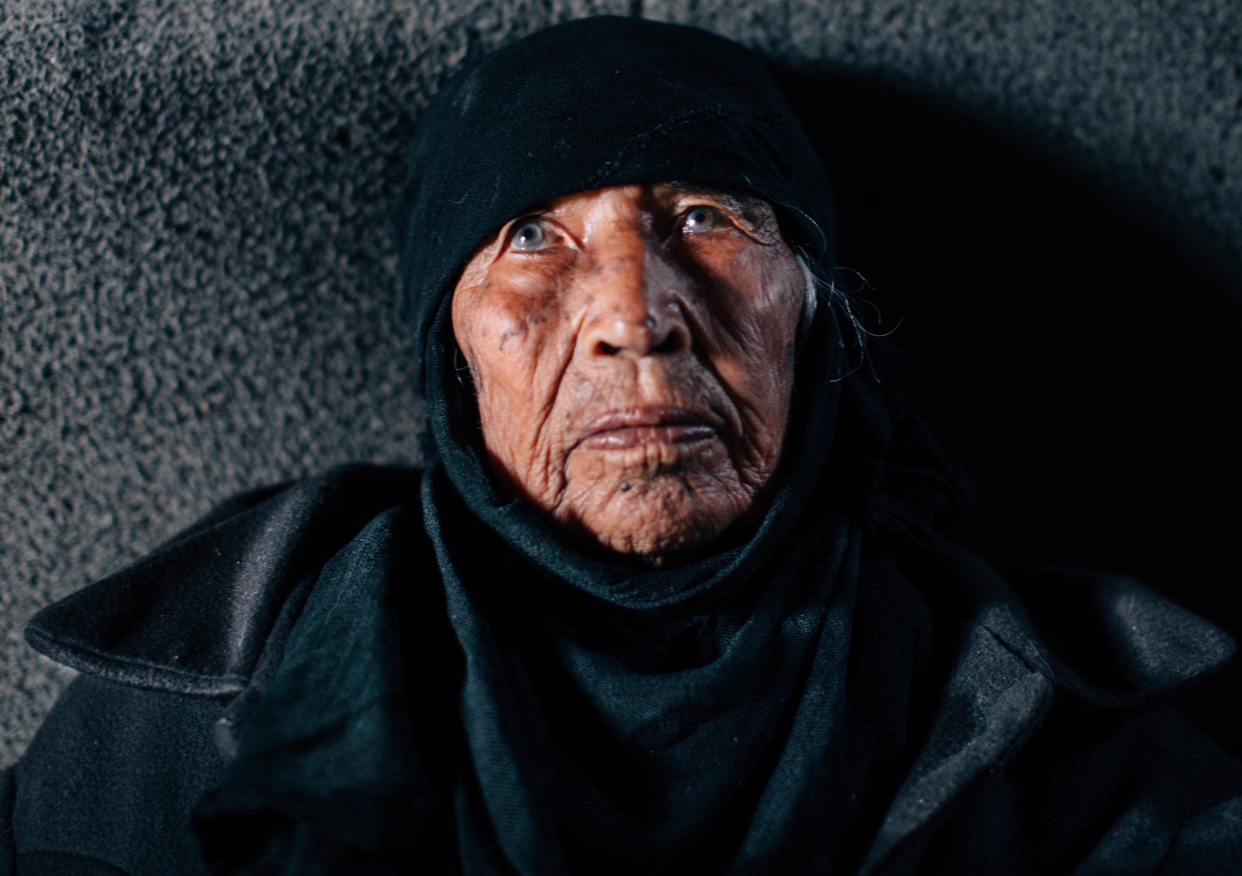 Fuda Al-Bareesh, 92, spends her days in her solitude at Alsalam 2 Camp. As temperatures consistently fall to -5 degrees celsius at night she has chosen staying warm over eating