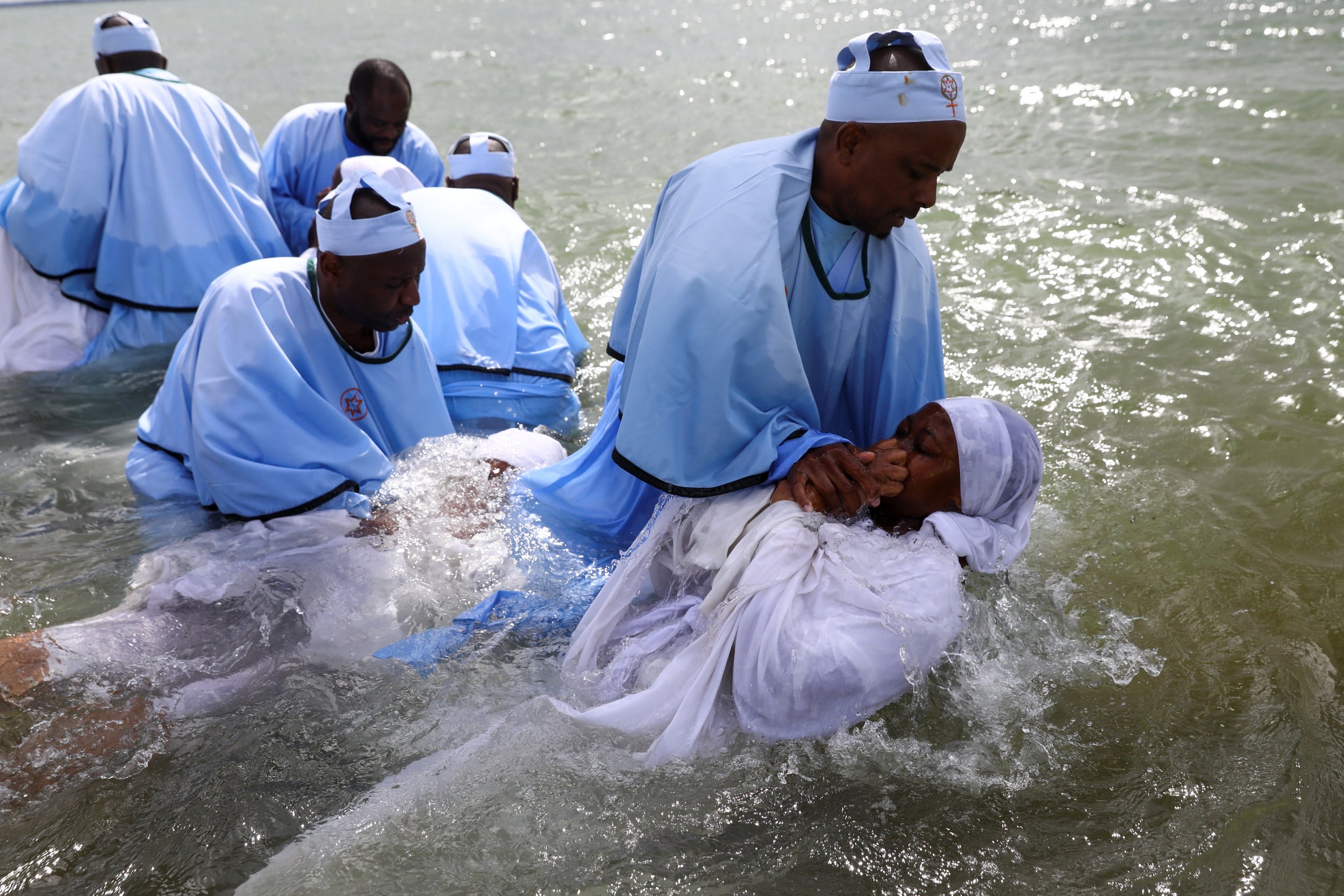 &#13;
Senior members of the Apostles Of Muchinjikwa Christian church baptise members on the beachfront on Southend-on-Sea &#13;