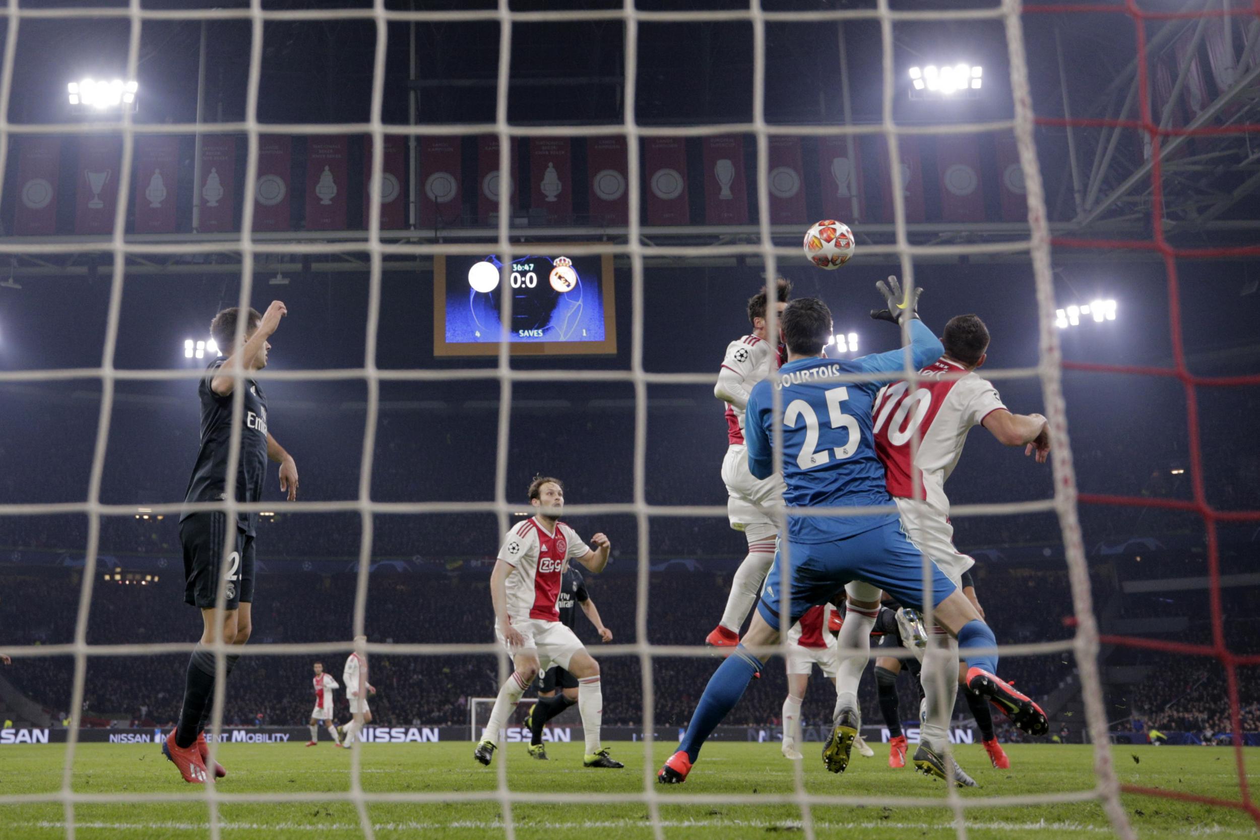 Tagliafico's header was ruled out as Courtois clattered into Tadic