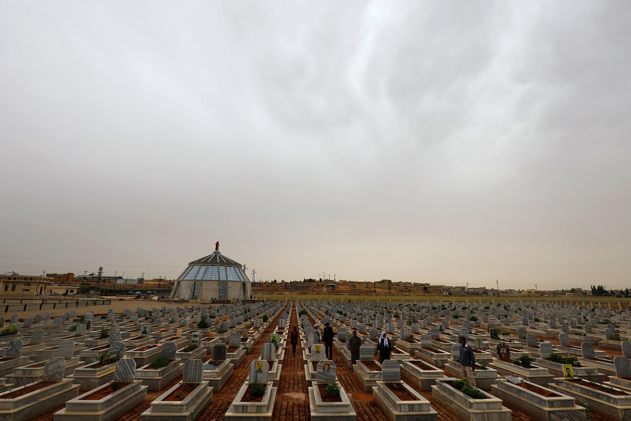 Syrian Kurds visit the tombs fighters who lost their lives fighting Isis