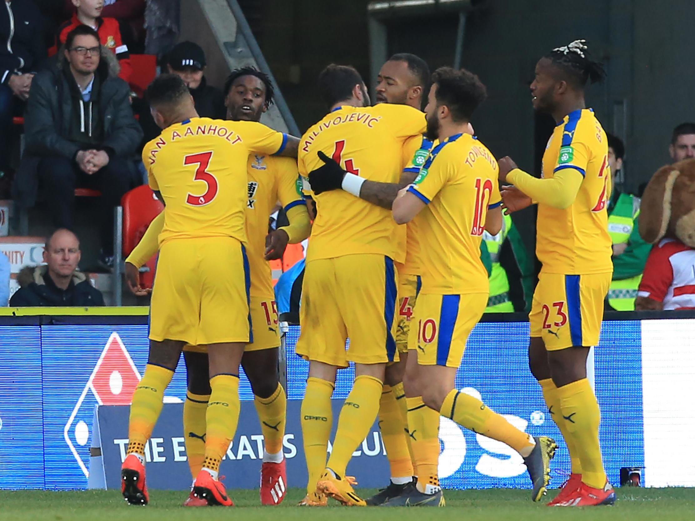 Jeffrey Schlupp celebrates opening the scoring for Crystal Palace