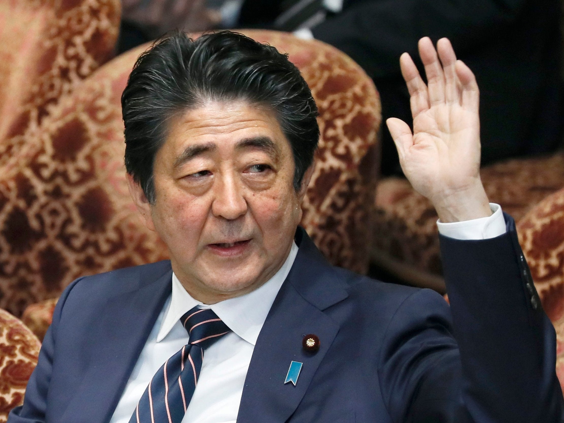 Japanese prime minister Shinzo Abe raises his hand during a parliamentary session at the Lower House in Tokyo, Japan, on 18 February 2019.