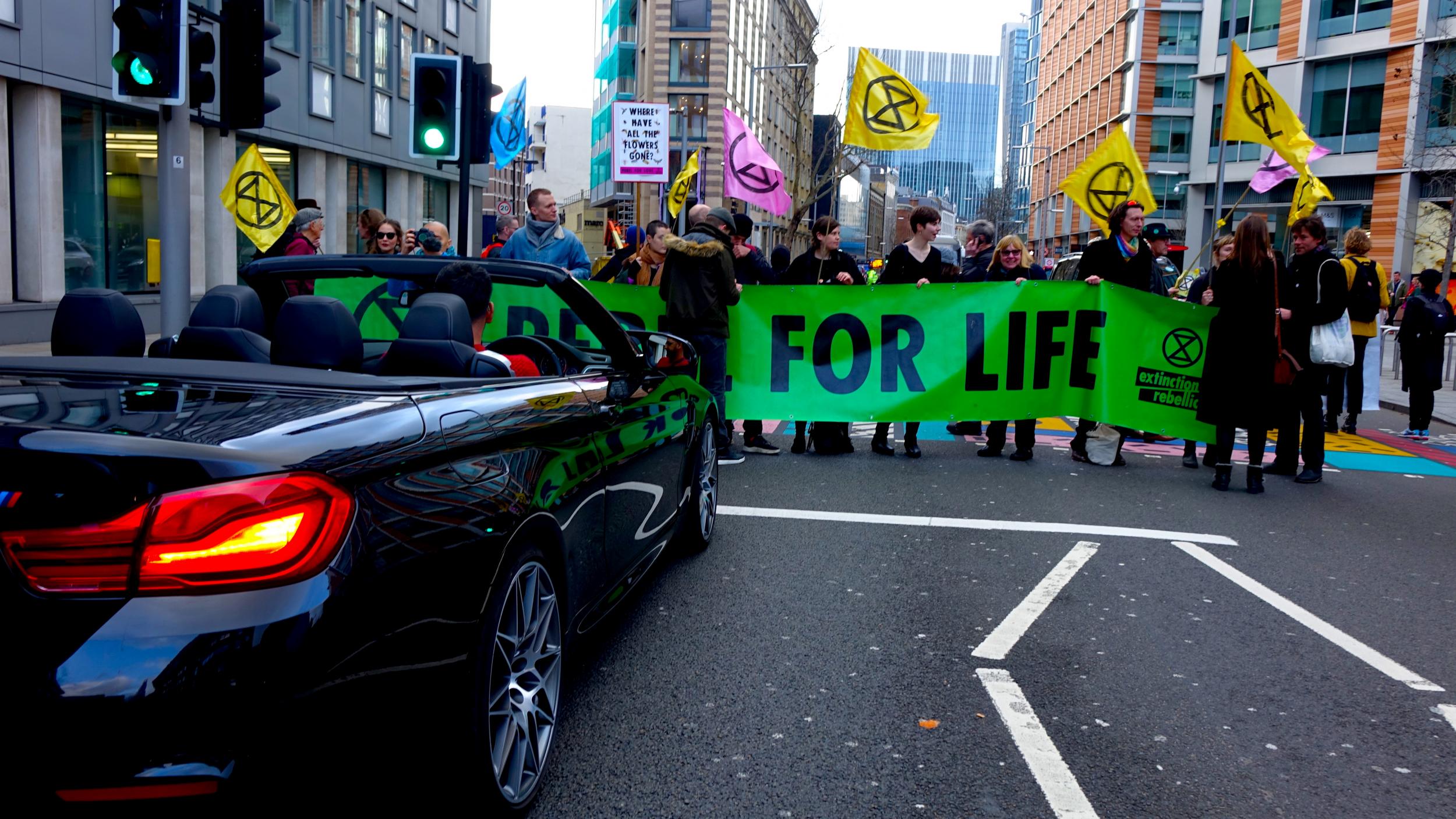Extinction Rebellion protestors block a road outside the Tate Gallery where Burberry held a show to protest impact of the fashion industry on the environment.