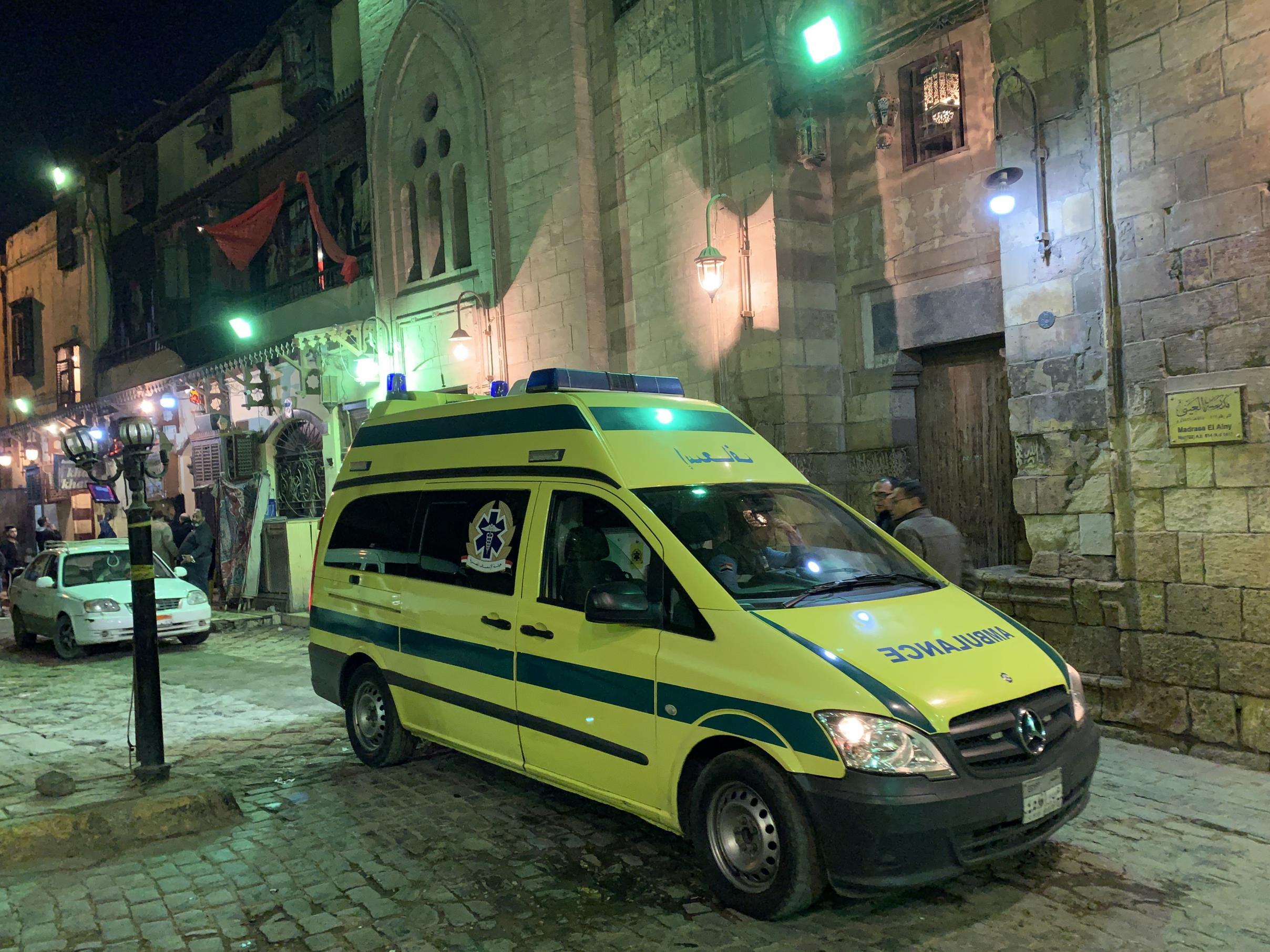 An ambulance arrives at the scene of an explosion behind a mosque near the Al-Azhar University