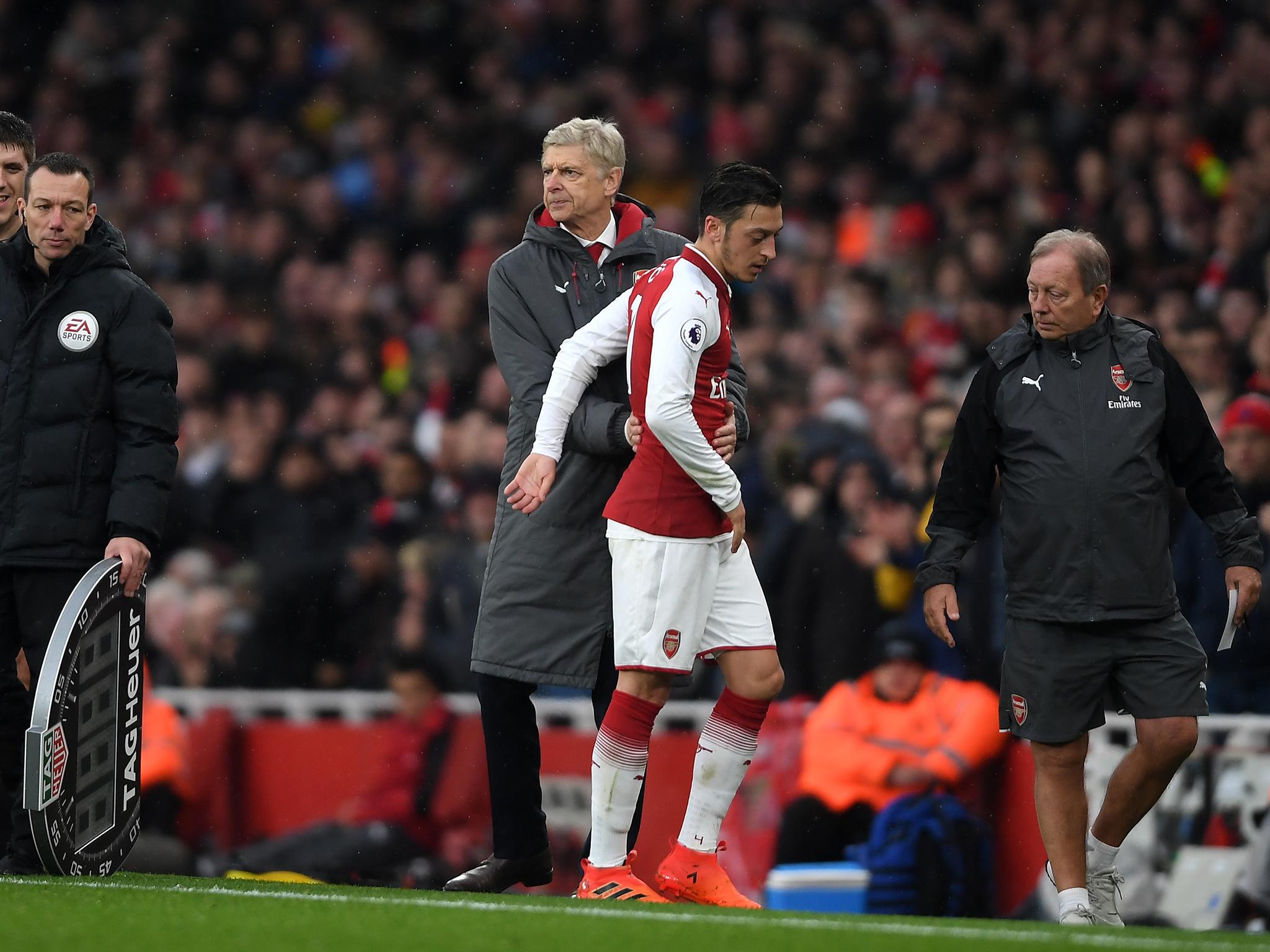 Wenger has questioned Ozil's effort levels at Arsenal since signing his new contract