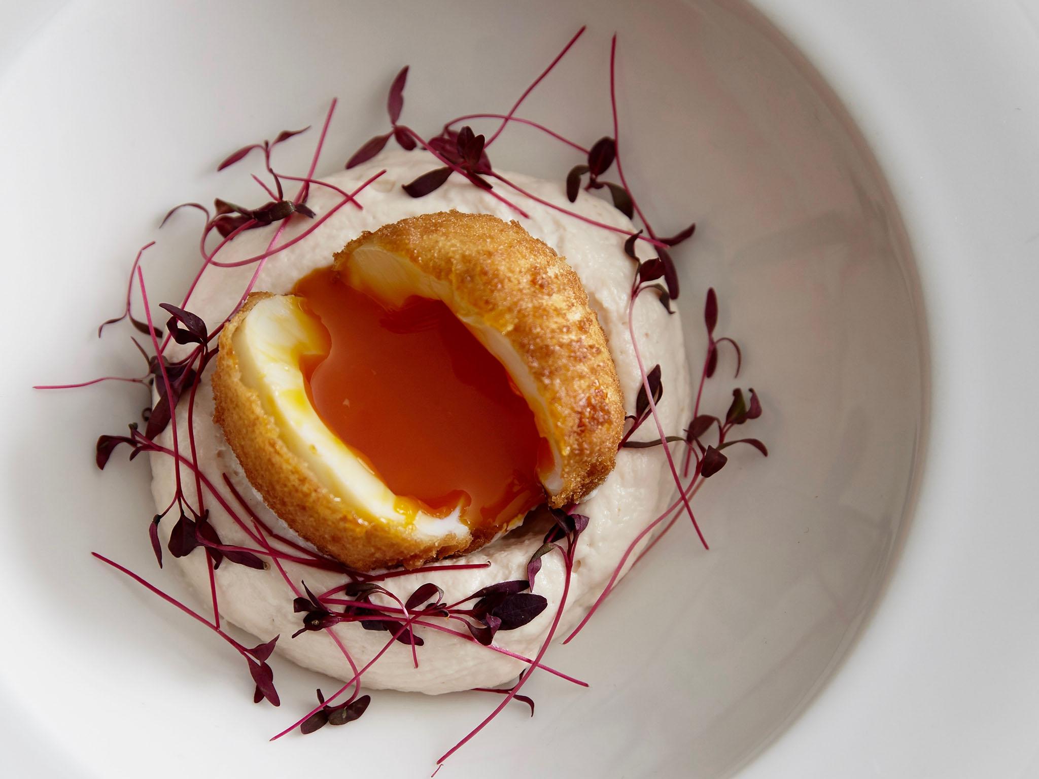 It’s a mix of modern British and food from 40 years ago, like this updated oozy and crispy egg