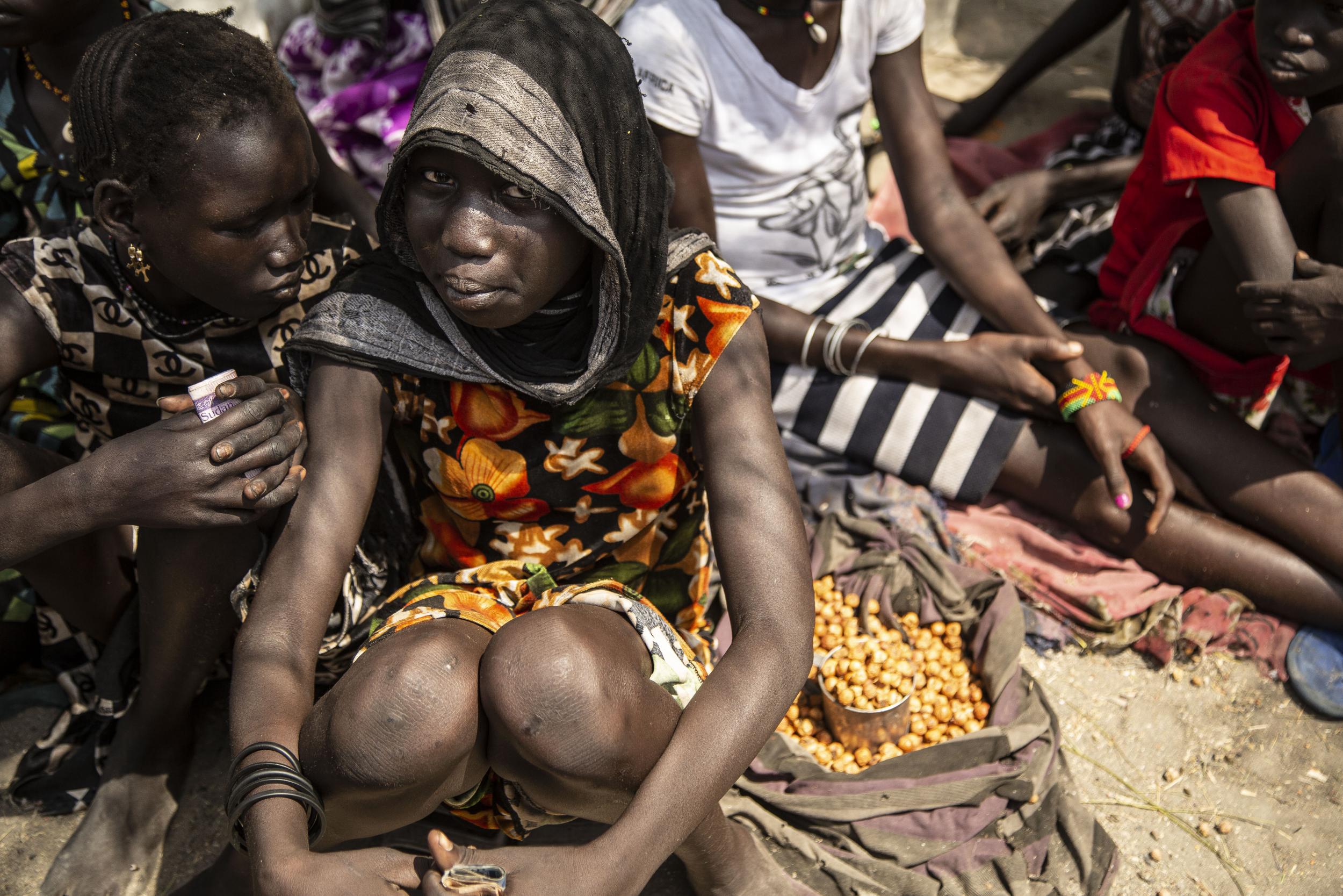 Women sell their wares at Pibor market in South Sudan