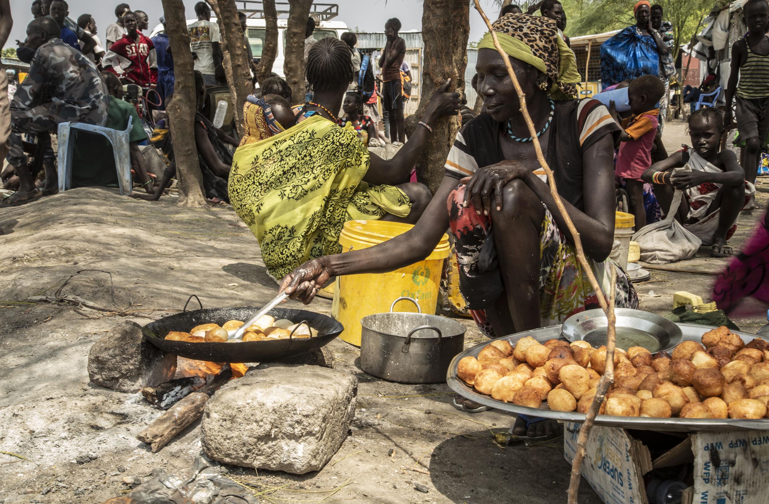 Women walk for hours and risk assault to earn a living at Pibor market, South Sudan