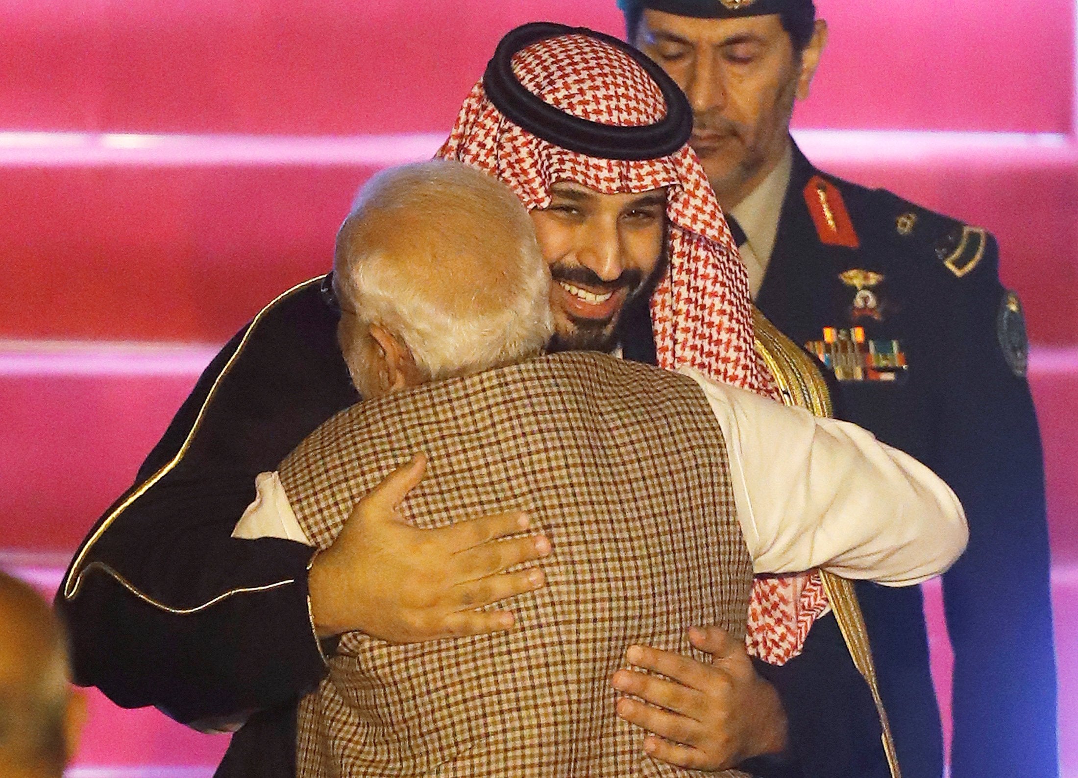 Saudi Arabia’s crown prince Mohammed bin Salman hugs India’s prime minister Narendra Modi upon his arrival at an airport in New Delhi on Tuesday