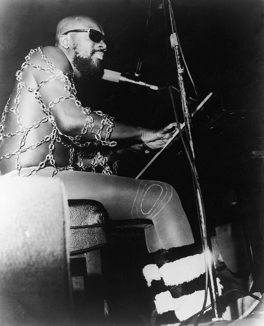 Funk and soul sensation Isaac Hayes performs in a chain top (Getty)