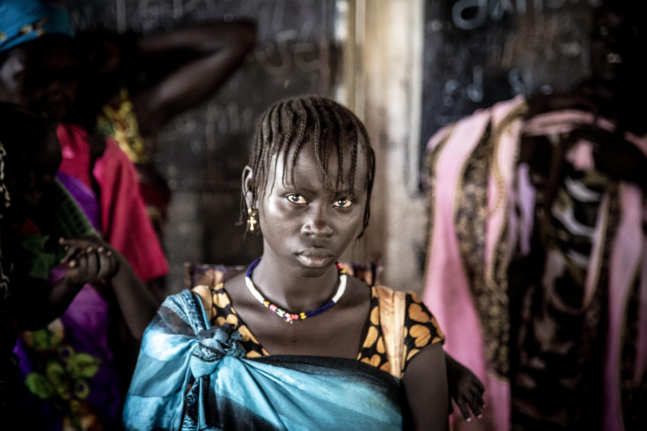 This young woman in Pibor regularly faces assault on her way to collect water, firewood and food