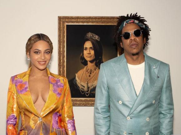 Beyonce and Jay Z accepted their Brit Award in front of a painting of Meghan Markle