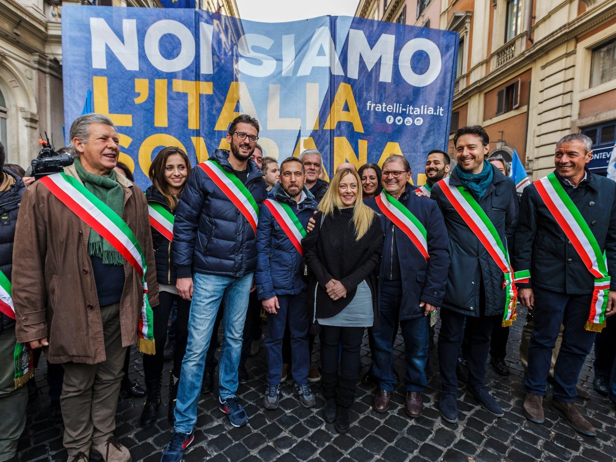 The post-fascist outfit is led by Giorgia Meloni (centre)