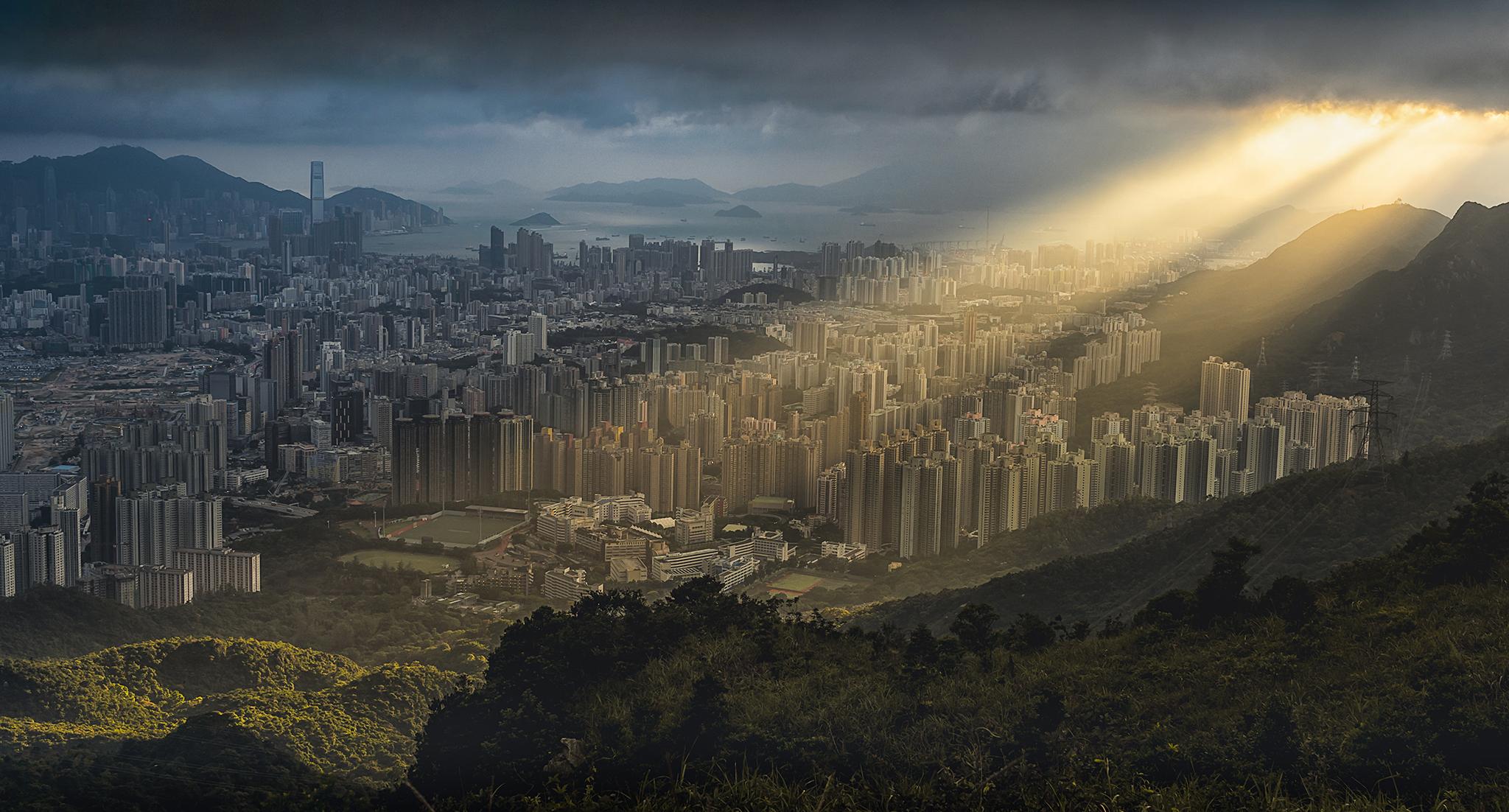 "Tropical Storm Barijat was just passing over Hong Kong, bringing with it this crepuscular ray that brightened up a part of Kowloon" - Tse Yuk Wai