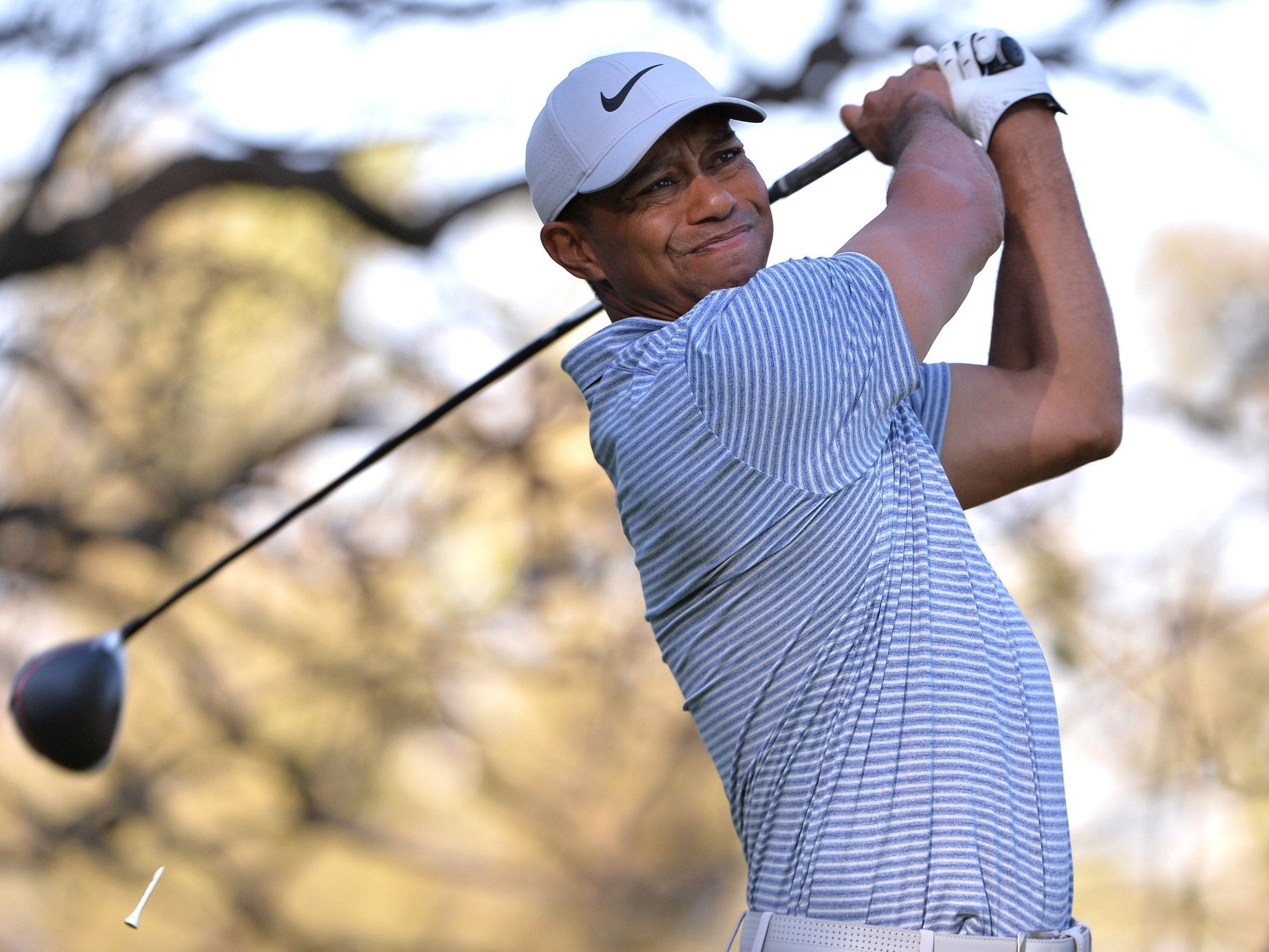 Tiger Woods got off to a bad start by hitting out of bounds on the first hole