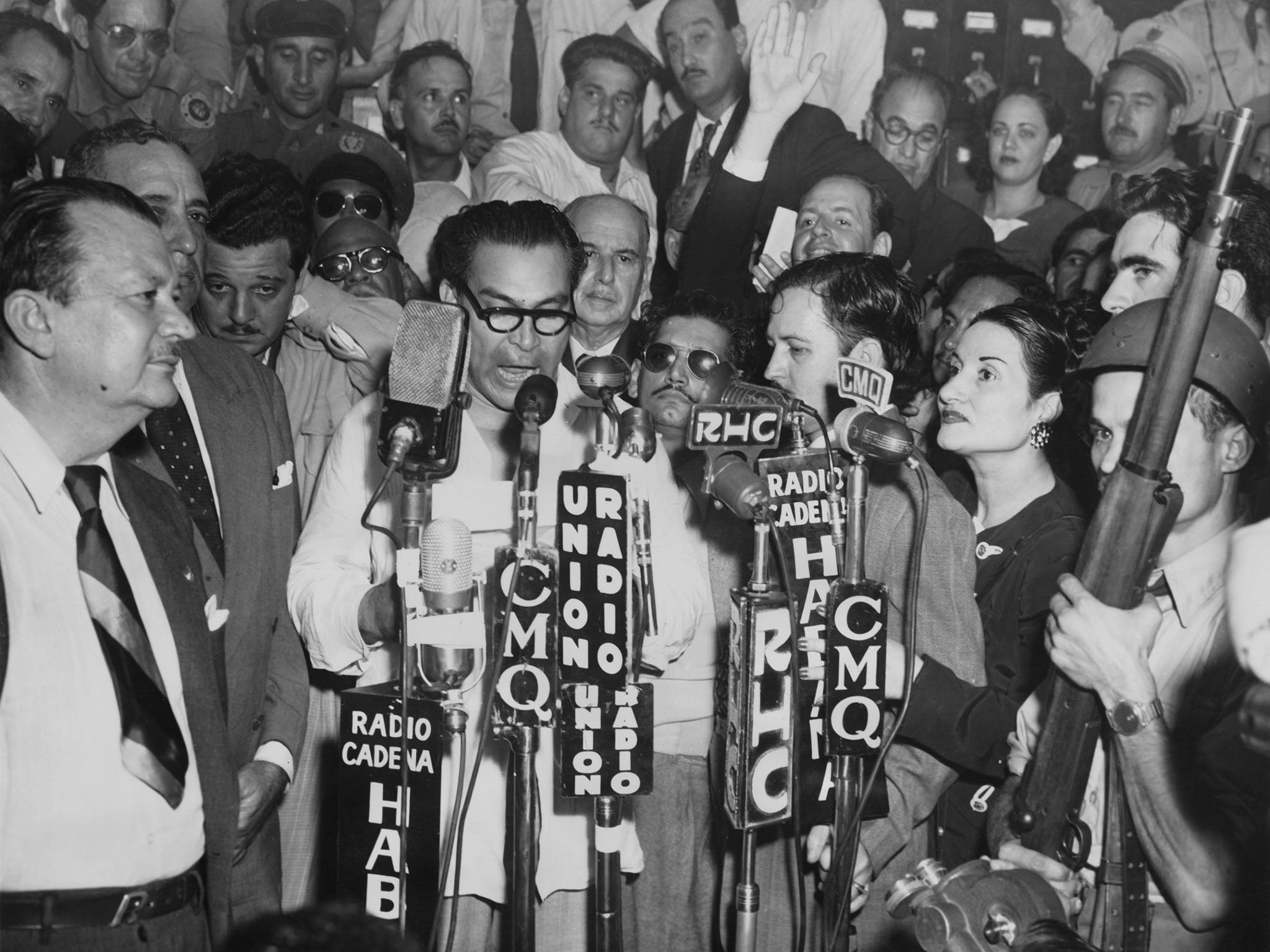 Fulgencio Batista surrounded by supporters after the military coup which restored him to power in 1952