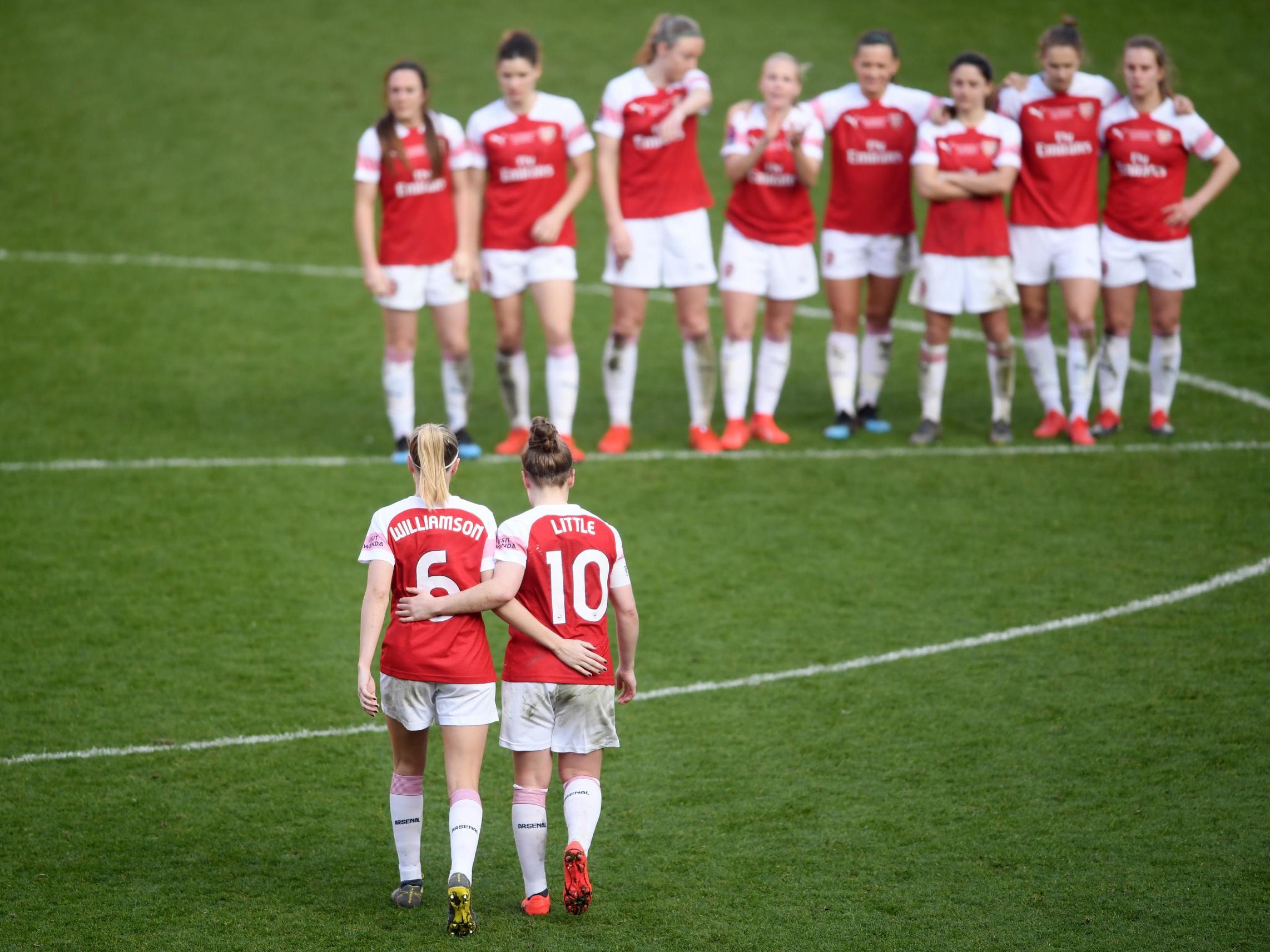 Leah Williamson and Kim Little look dejected following defeat