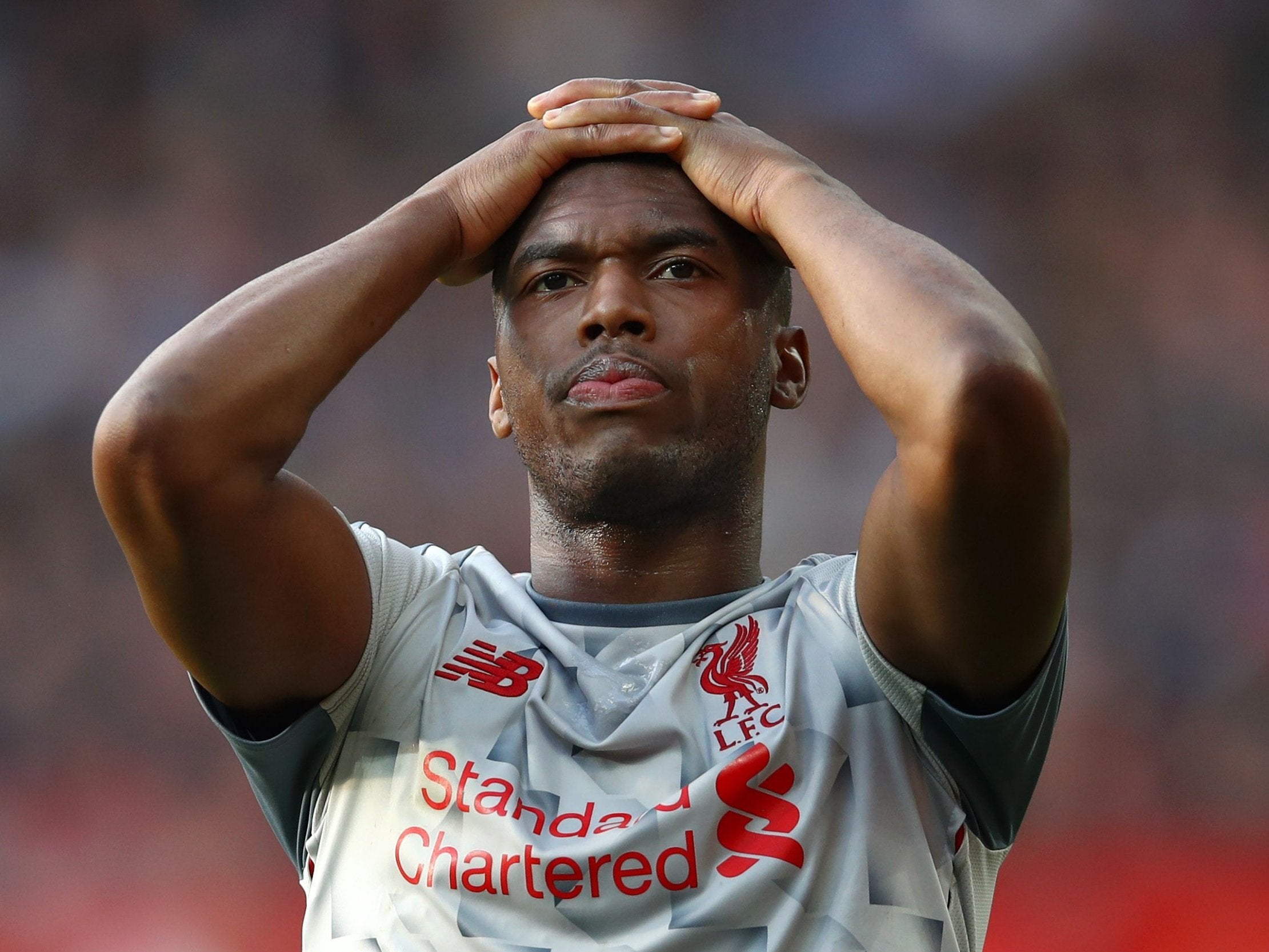 Daniel Sturridge reacts after a missed opportunity