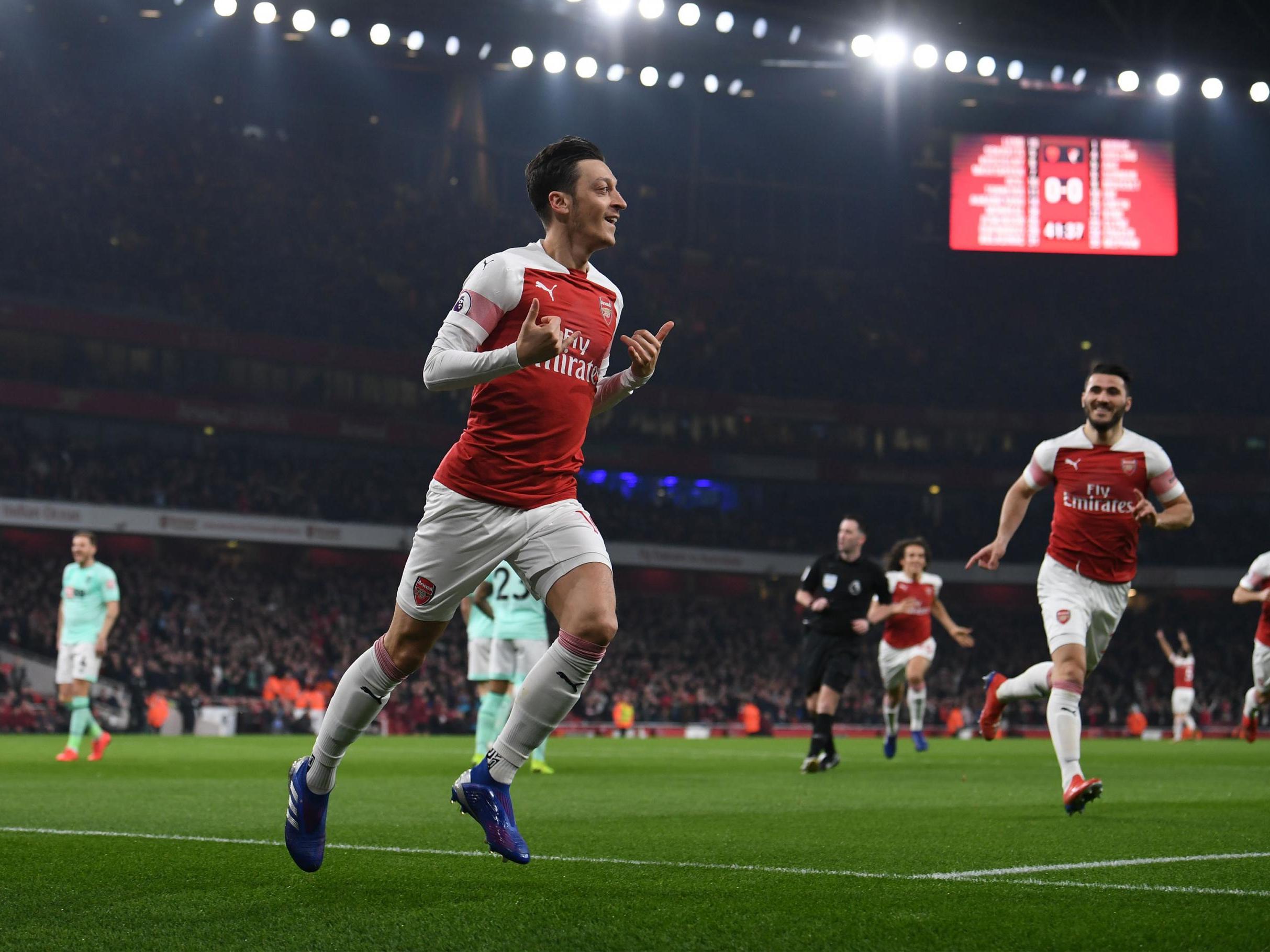 Mesut Ozil celebrates for Arsenal