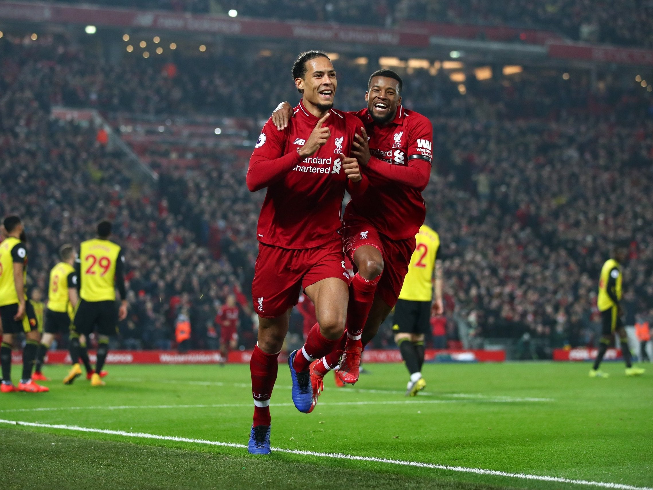 Van Dijk and Wijnaldum celebrate