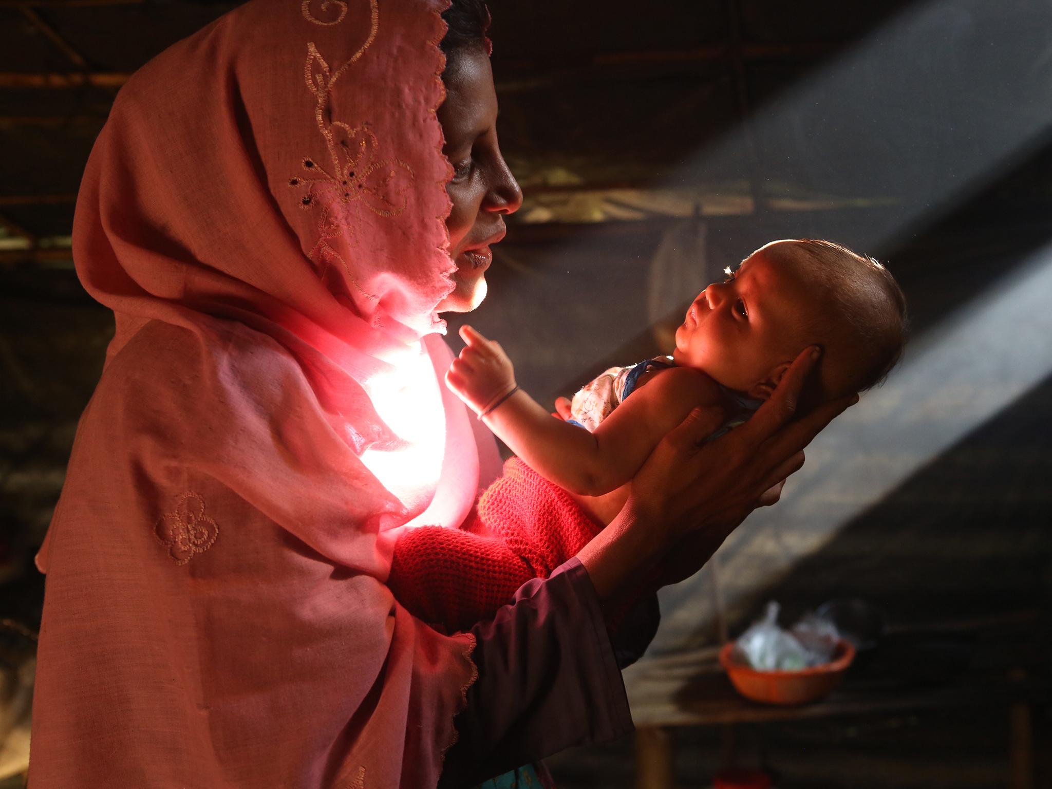 Marjina*, 25, with her two-month-old daughter Asma in Balukhali refugee camp