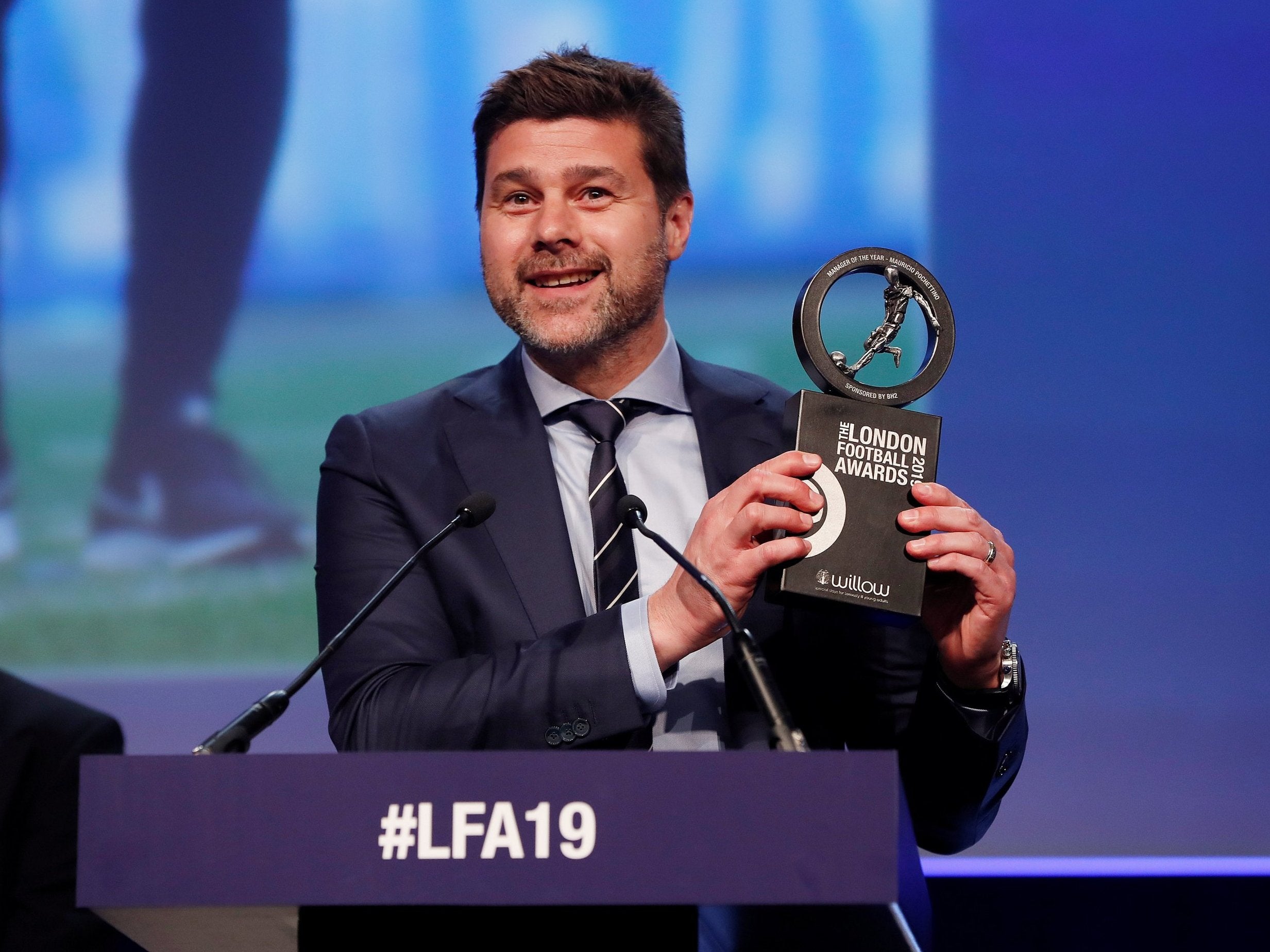 Pochettino collects his trophy for winning Manager of the Year at the London Football Awards