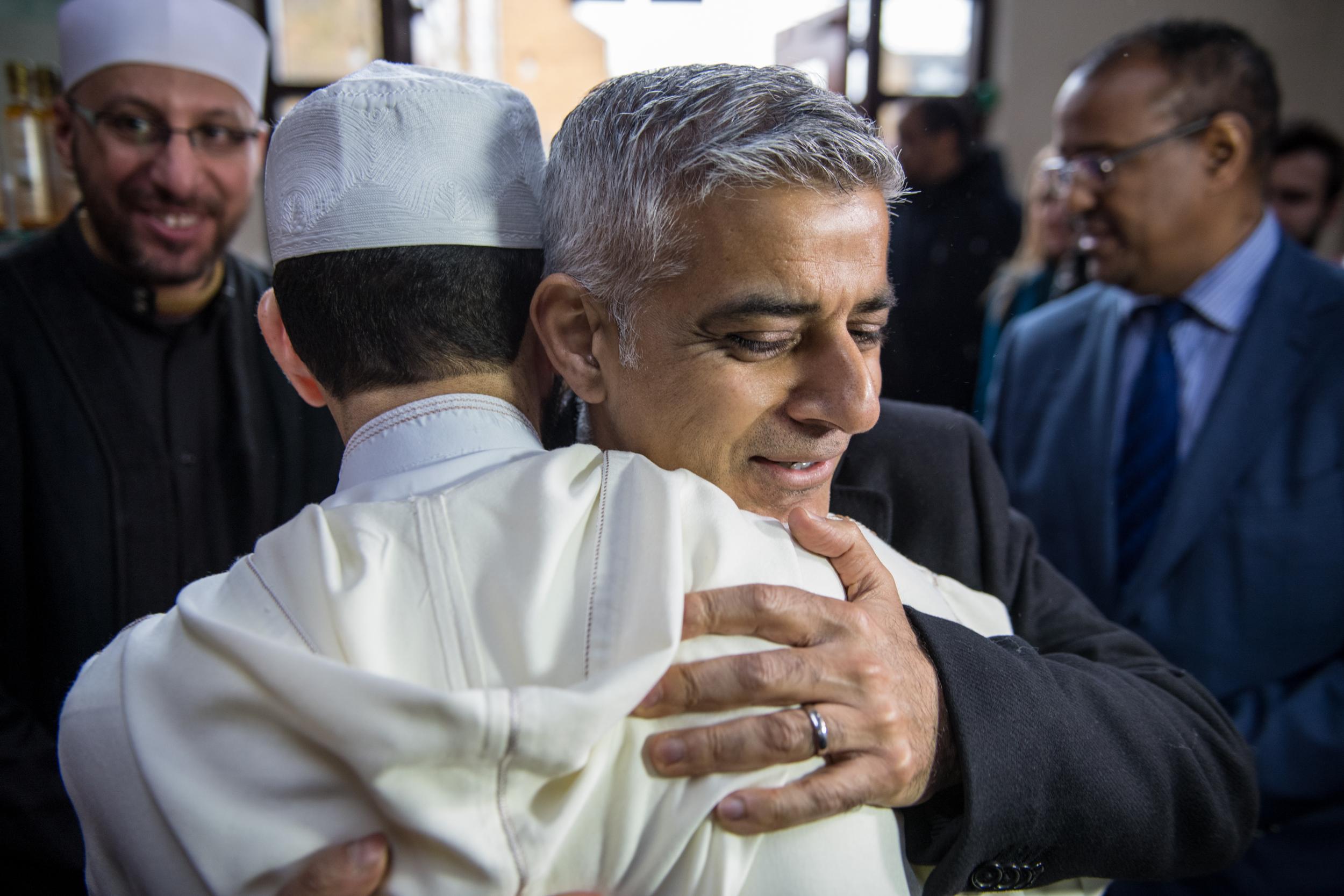 London mayor Sadiq Khan embraces a Muslim cultural leader during a visit to Al Manaar mosque on Visit My Mosque Day on 18 February 2018 in London, England