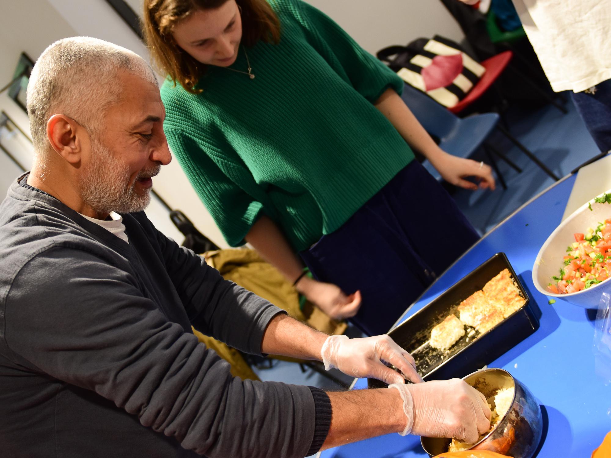 Osman shows one of his students the precise art of the Egyptian falafel