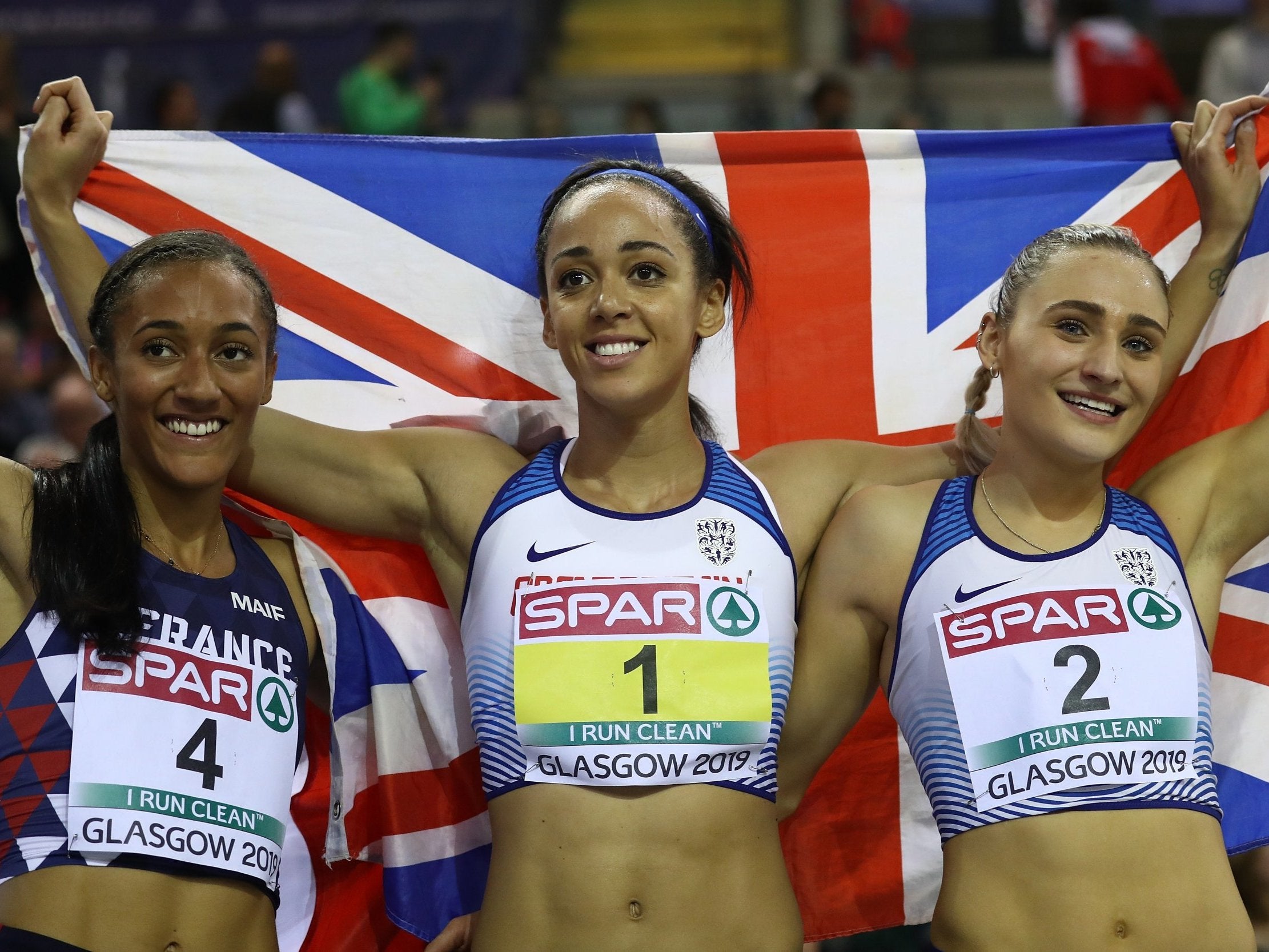 Solene Ndama (L) Katarina Johnson-Thompson (C) and Niamh Emerson (R) celebrate after winning medals in the women's pentathlon