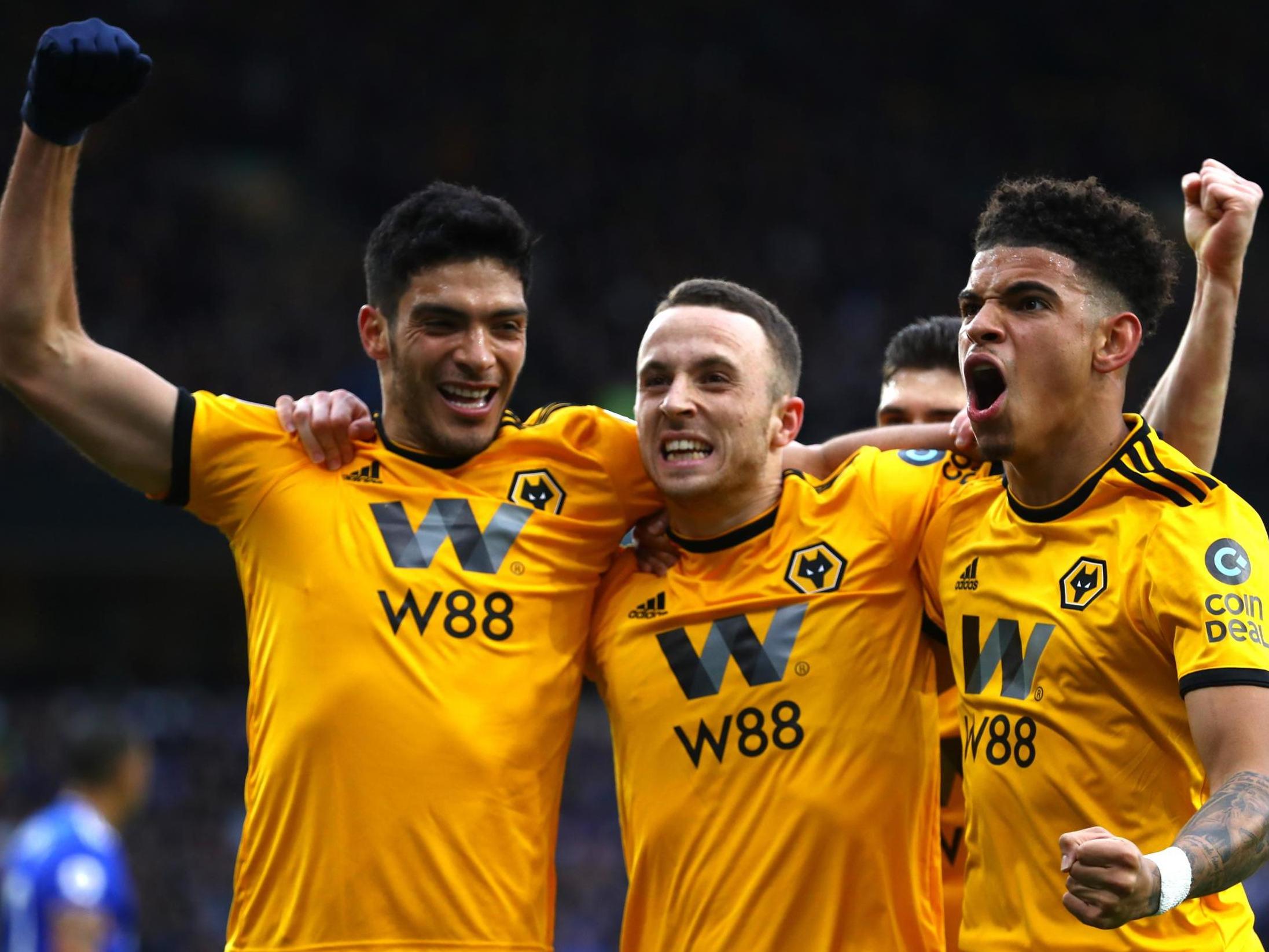 Diogo Jota celebrates with Raul Jimenez after securing Wolves' victory (Getty)
