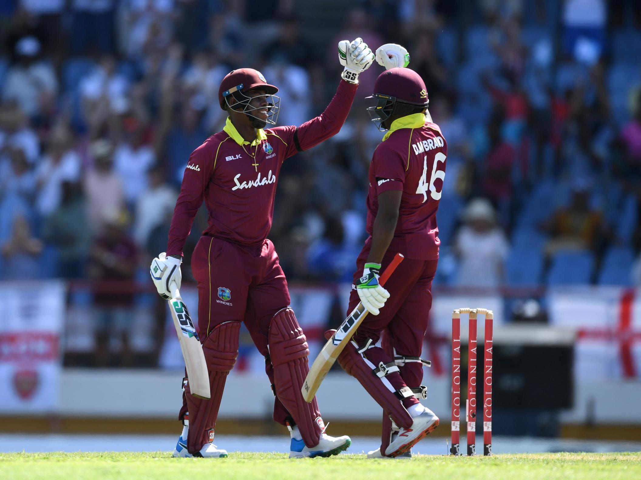 Shimron Hetmyer and Darren Bravo celebrate winning the fifth ODI